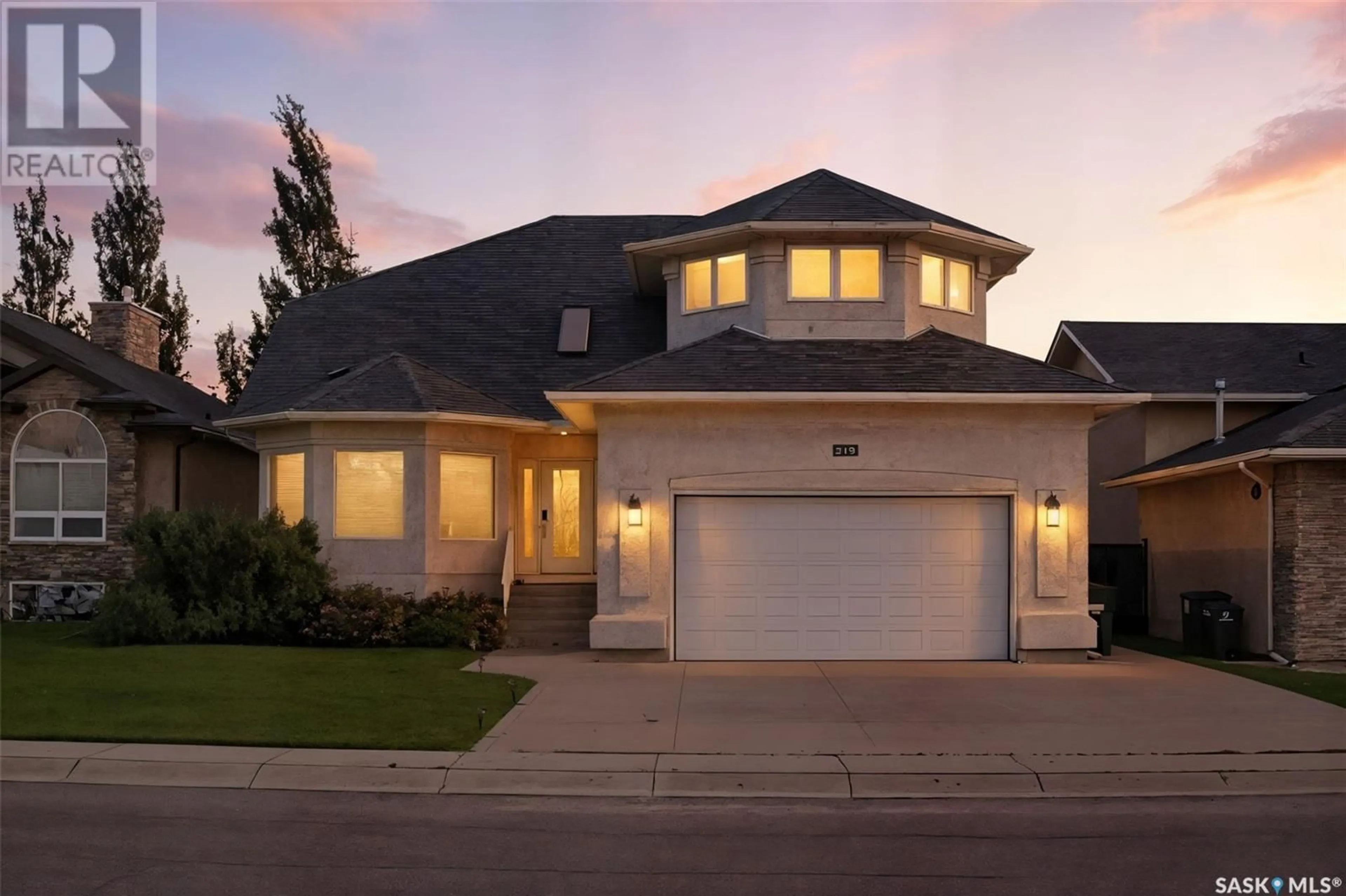Home with vinyl exterior material, street for 319 THODE AVENUE, Saskatoon Saskatchewan S7W1A1