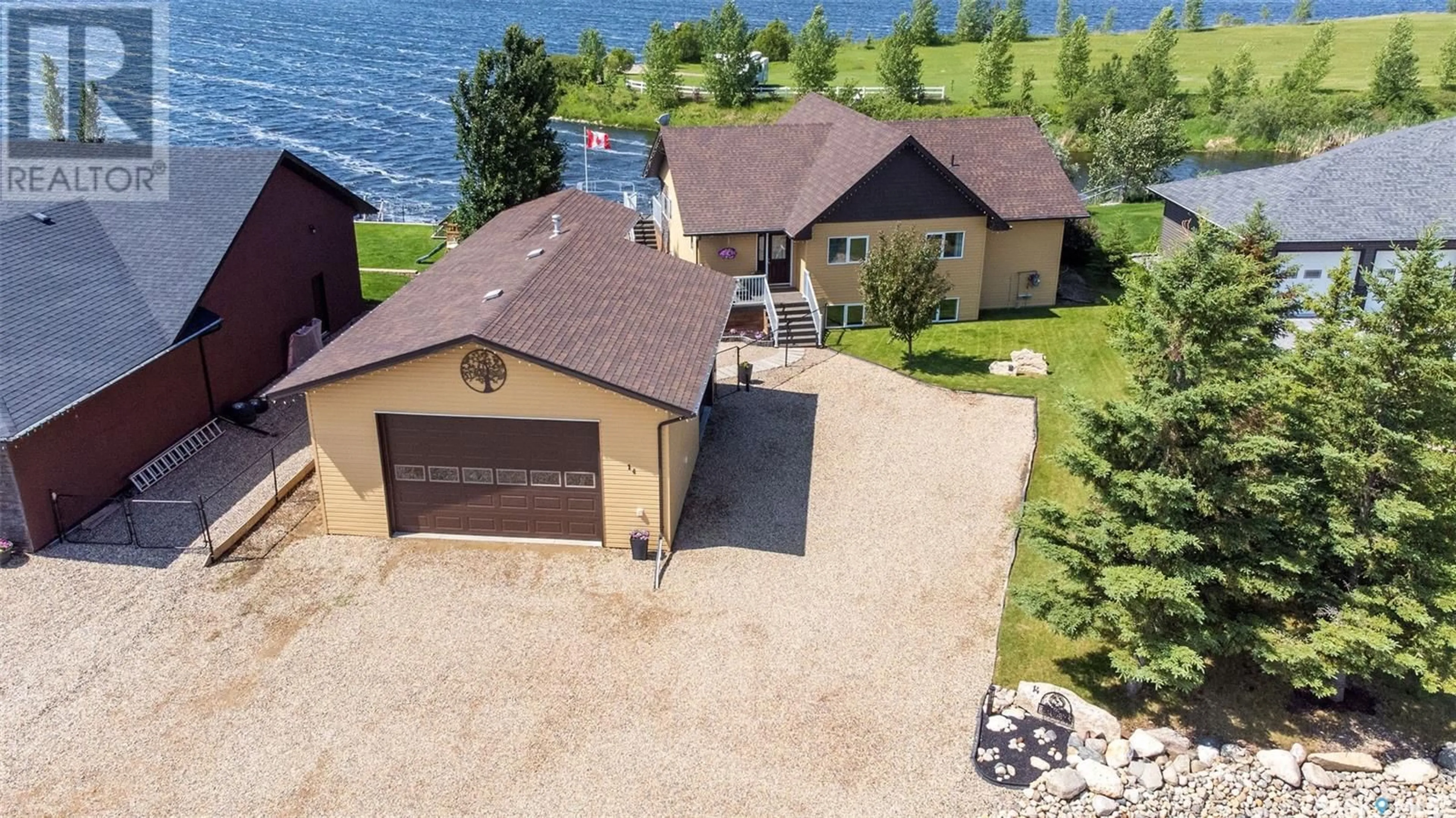 A pic from outside/outdoor area/front of a property/back of a property/a pic from drone, water/lake/river/ocean view for 14 PAPE ROAD, Humboldt Saskatchewan S0K2A0