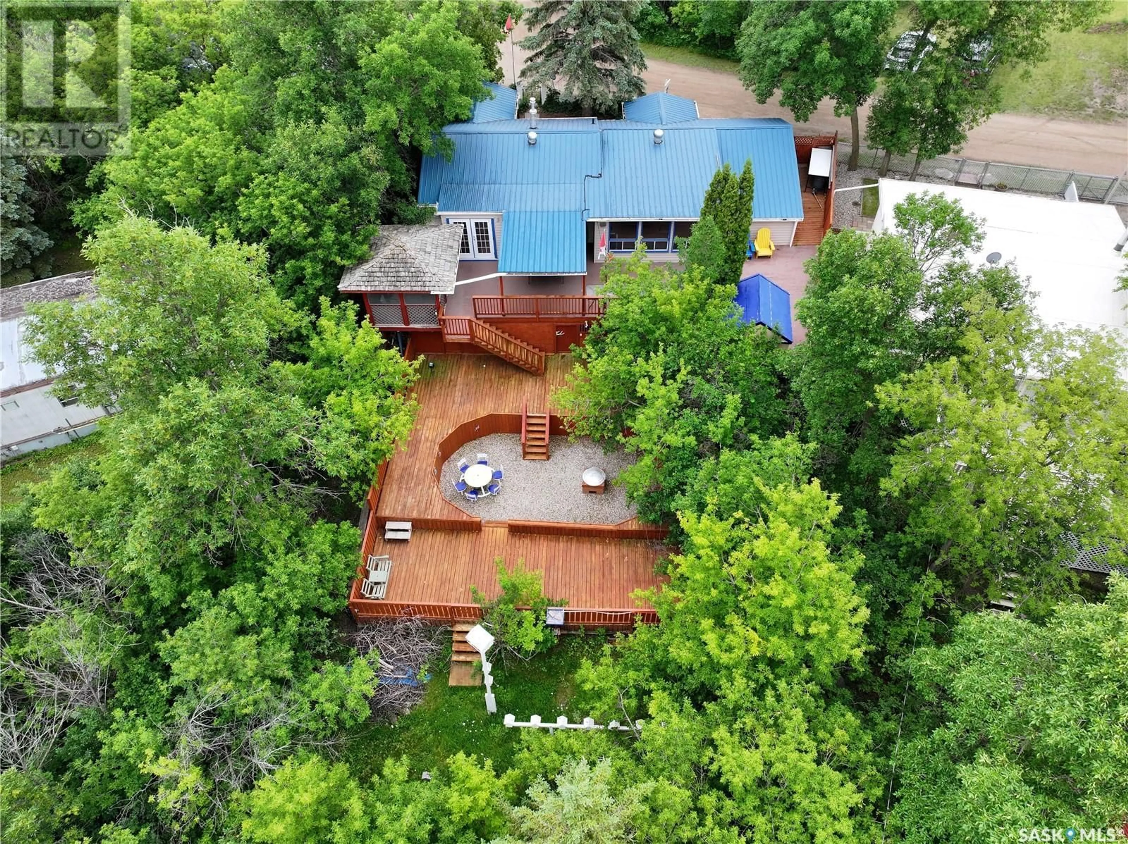 A pic from outside/outdoor area/front of a property/back of a property/a pic from drone, forest/trees view for 108 BRIERE DRIVE, Regina Beach Saskatchewan S0G4C0