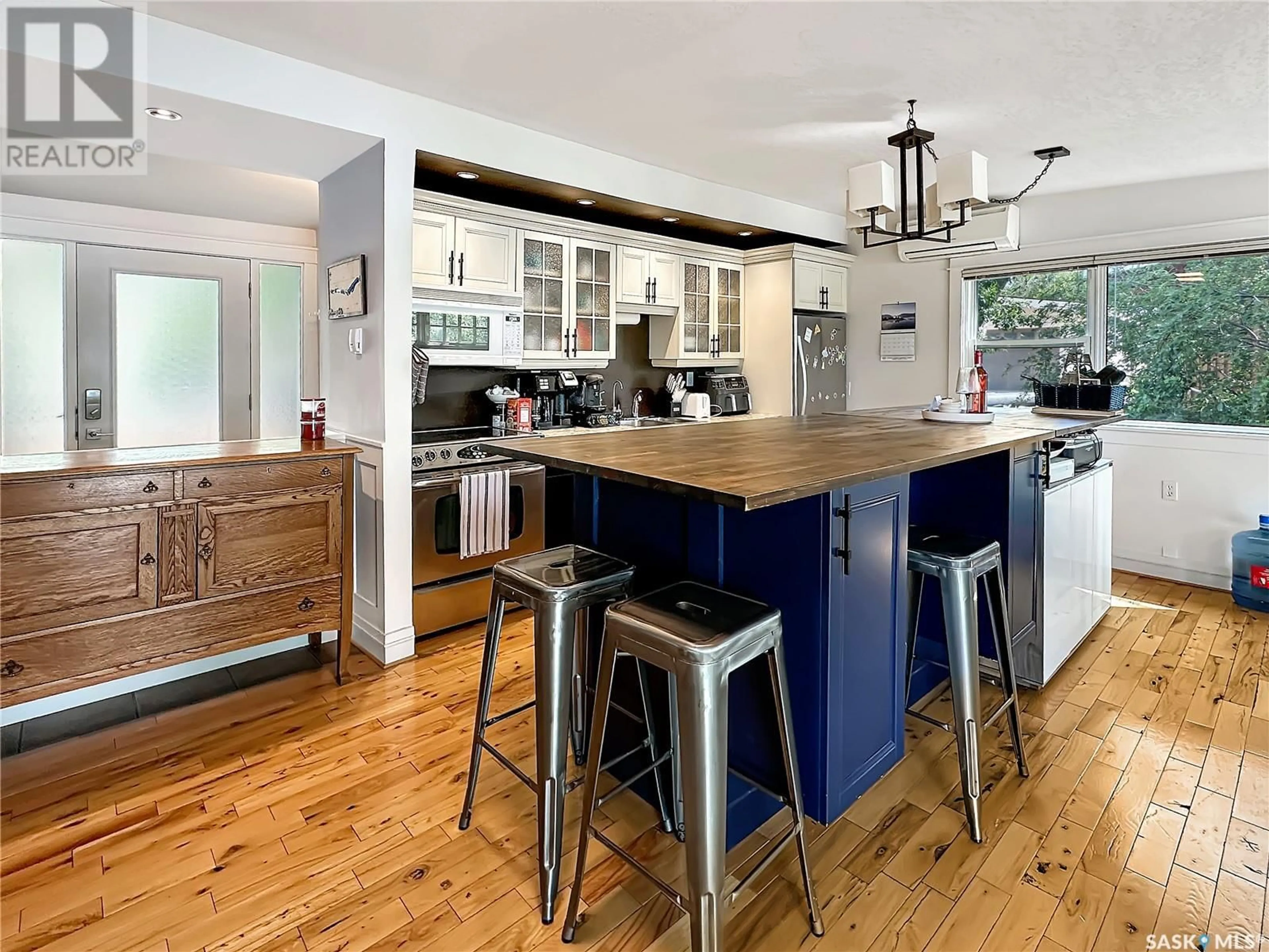 Open concept kitchen, wood/laminate floor for 402 PASQUA LAKE ROAD, North Qu'Appelle Rm No. 187 Saskatchewan S0G1S0