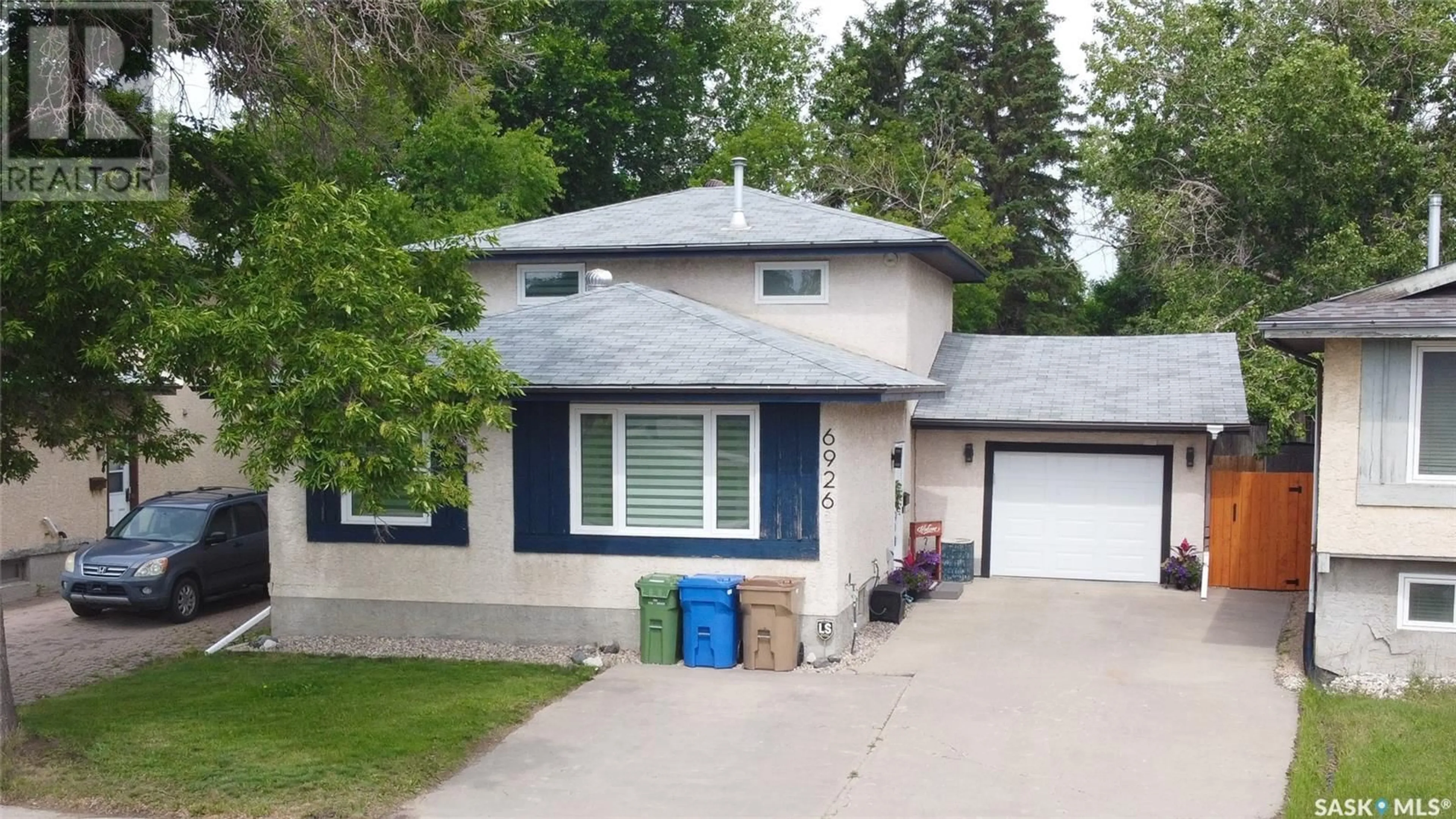Home with vinyl exterior material, street for 6926 DALGLIESH DRIVE, Regina Saskatchewan S4R2M6