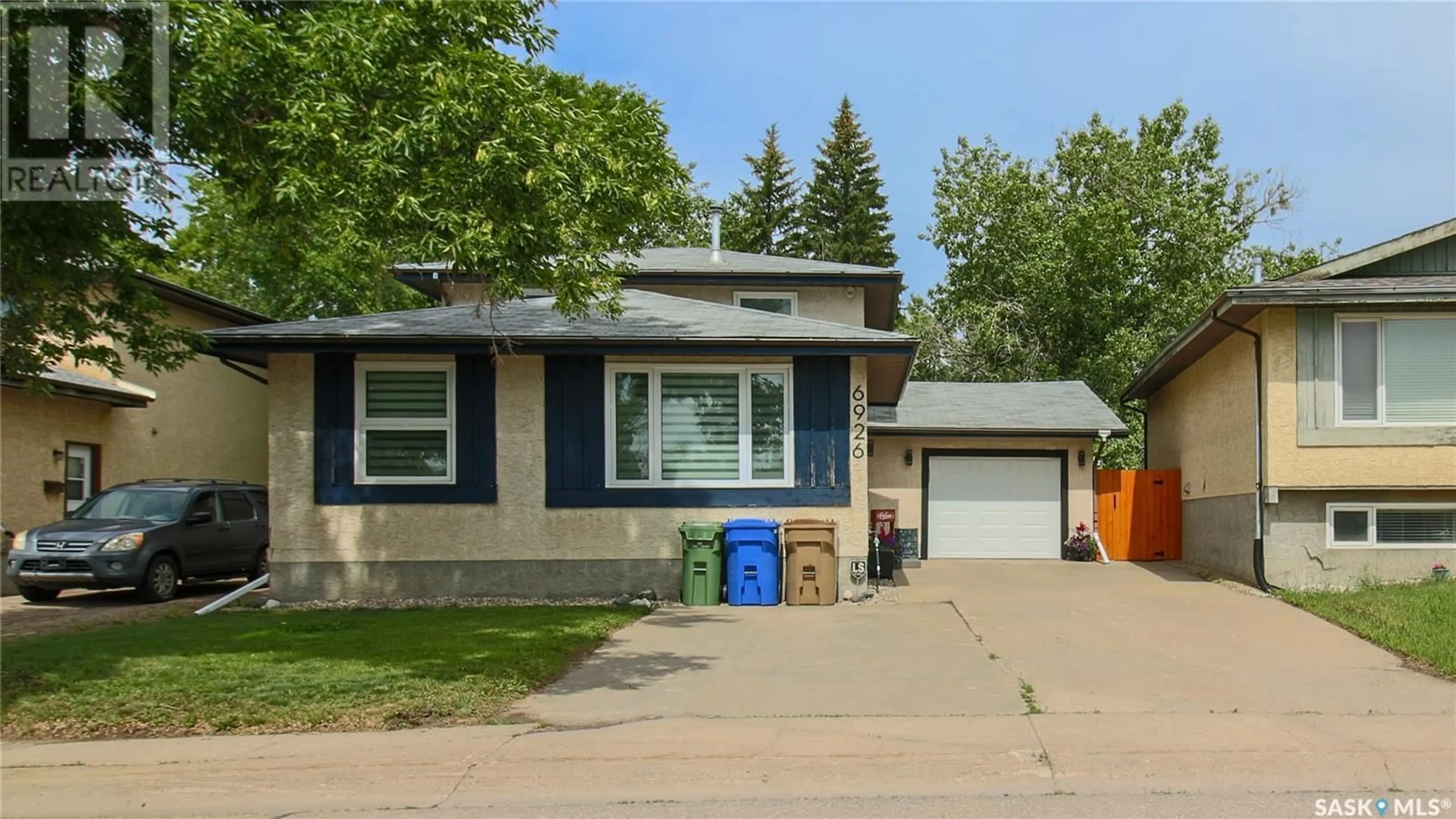 Home with vinyl exterior material, street for 6926 DALGLIESH DRIVE, Regina Saskatchewan S4R2M6
