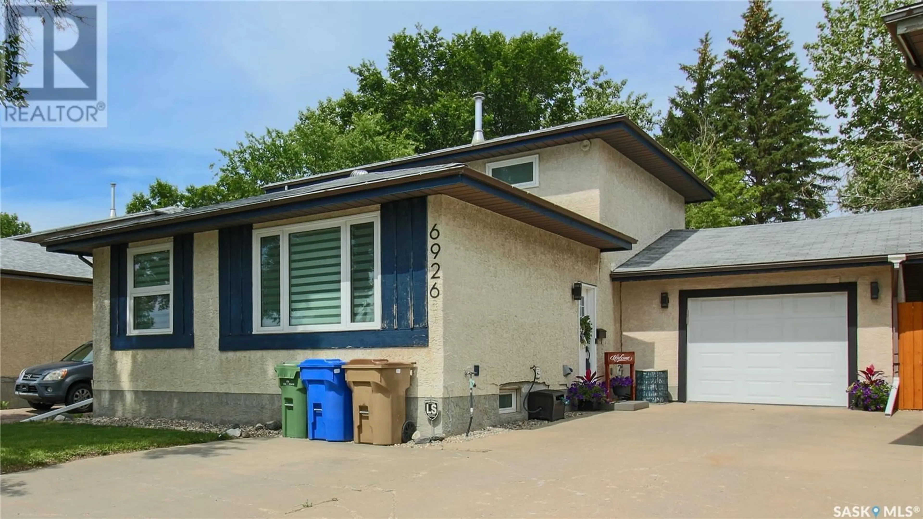 Home with vinyl exterior material, street for 6926 DALGLIESH DRIVE, Regina Saskatchewan S4R2M6