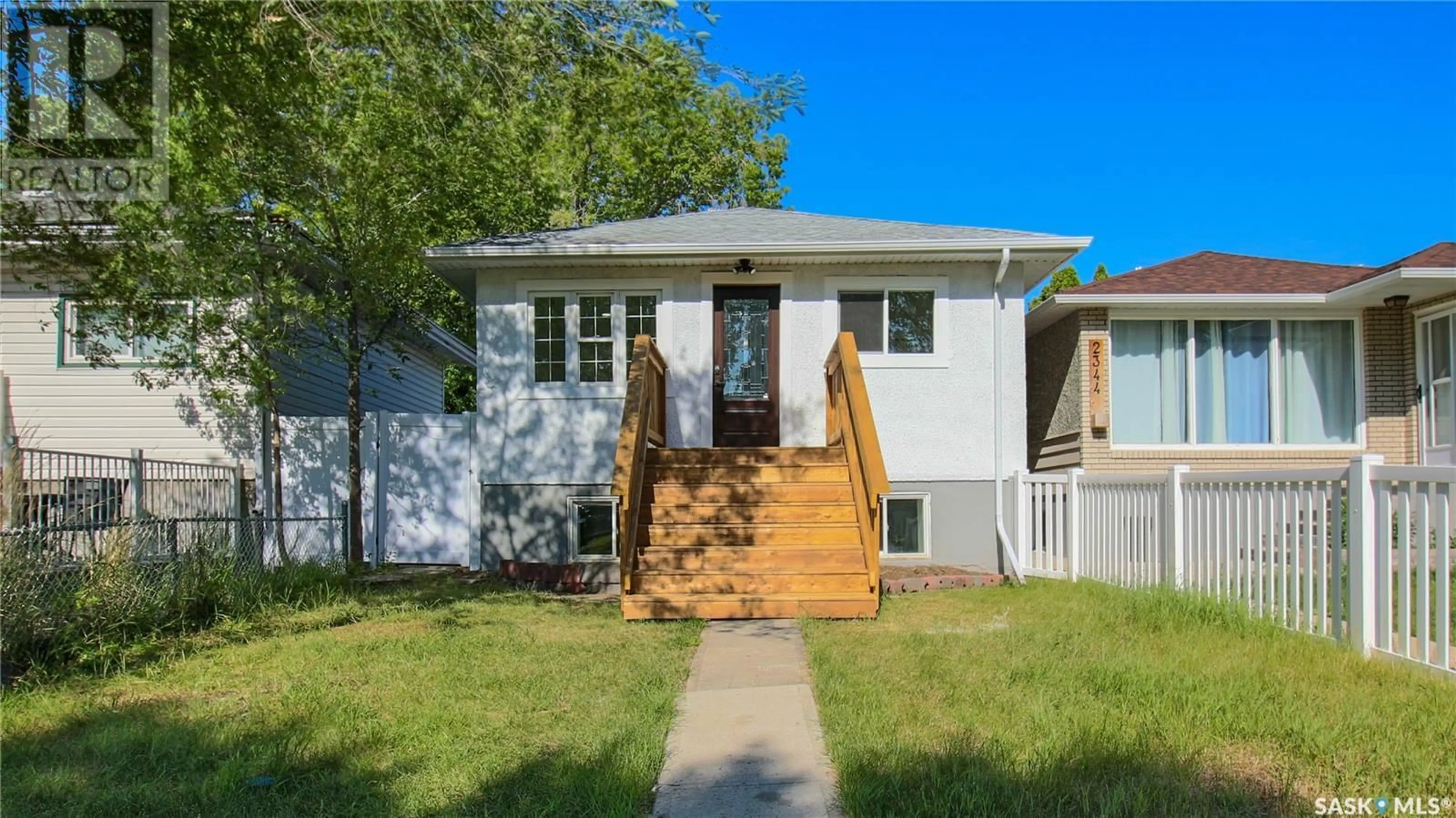 Home with vinyl exterior material, street for 2346 MCARA STREET, Regina Saskatchewan S4N2W3