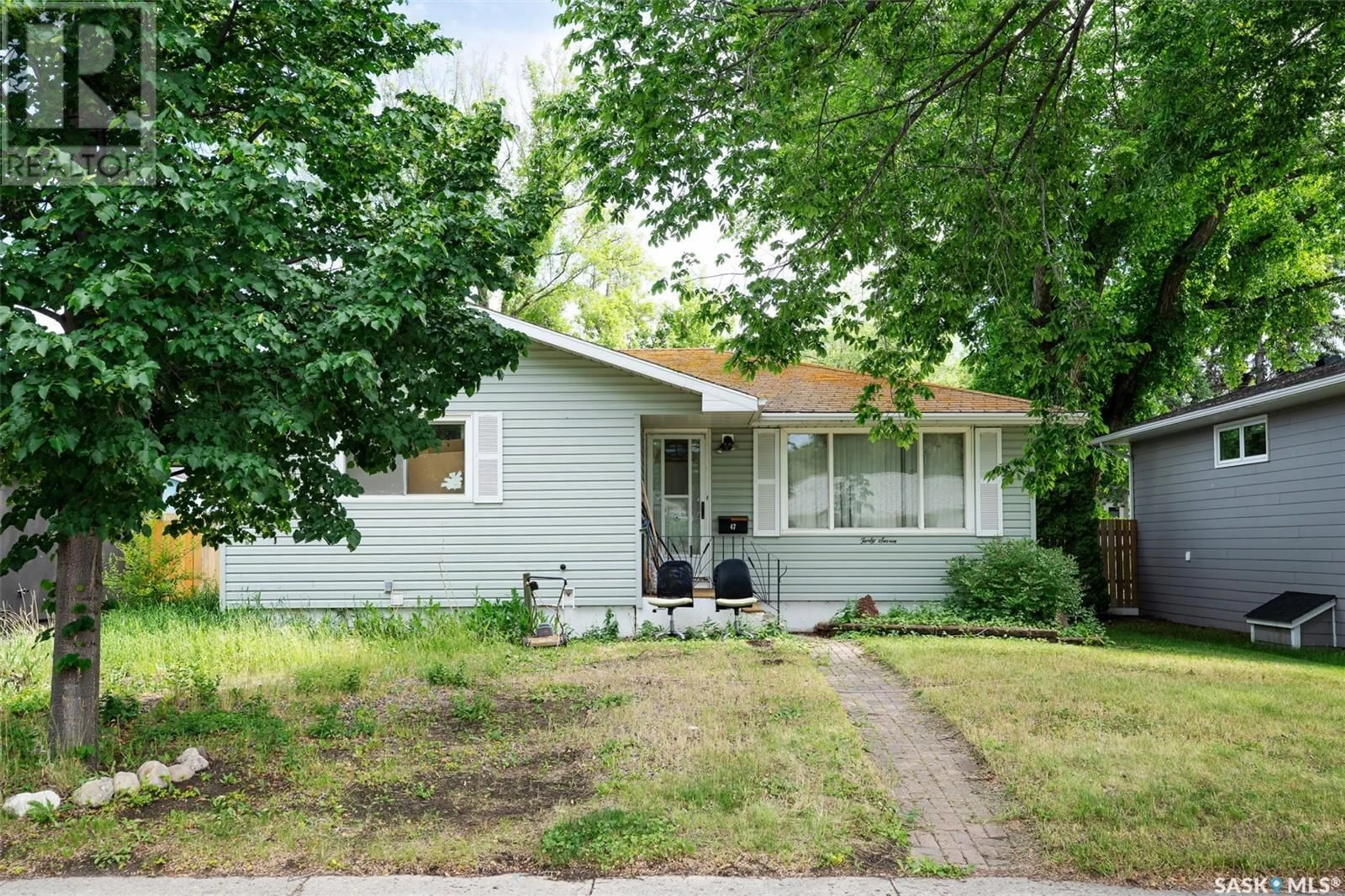 Home with vinyl exterior material, street for 47 BELL CRESCENT, Saskatoon Saskatchewan S7J2W2