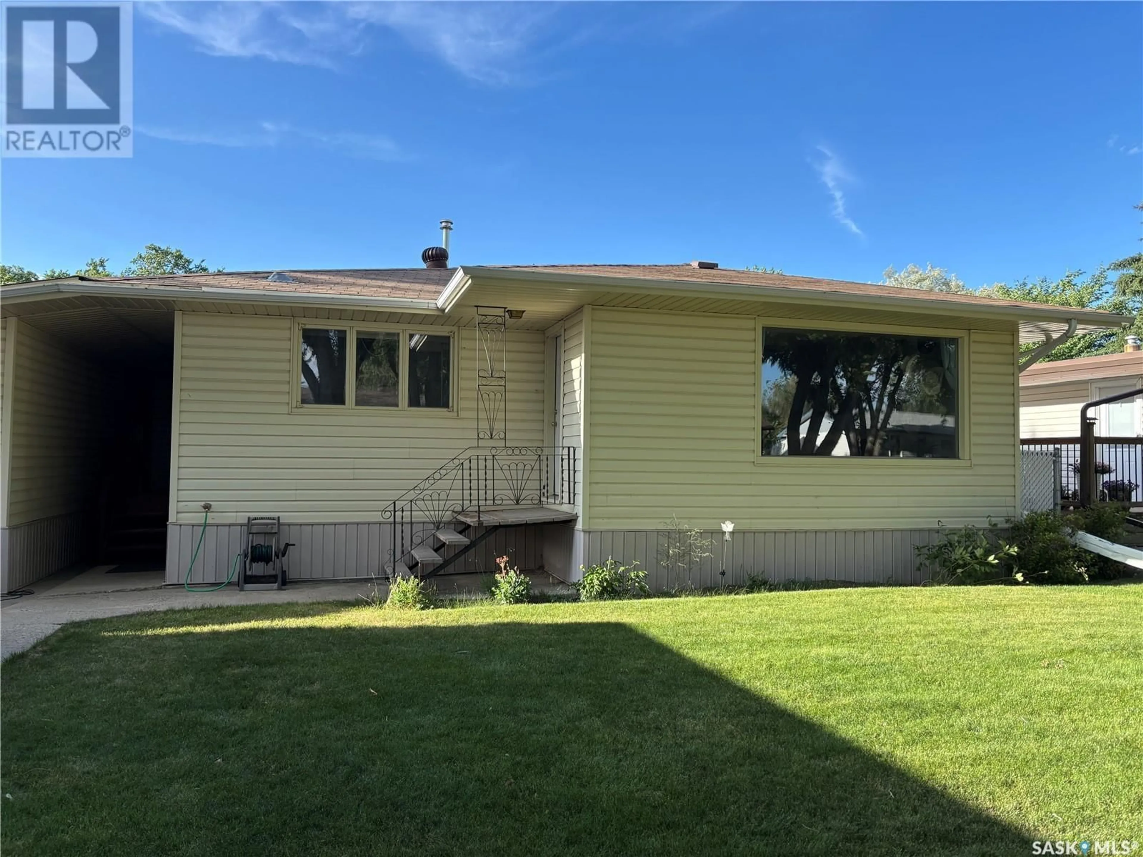 Home with vinyl exterior material, street for 104 CLAUSTRE AVENUE, Maple Creek Saskatchewan S0N1N0