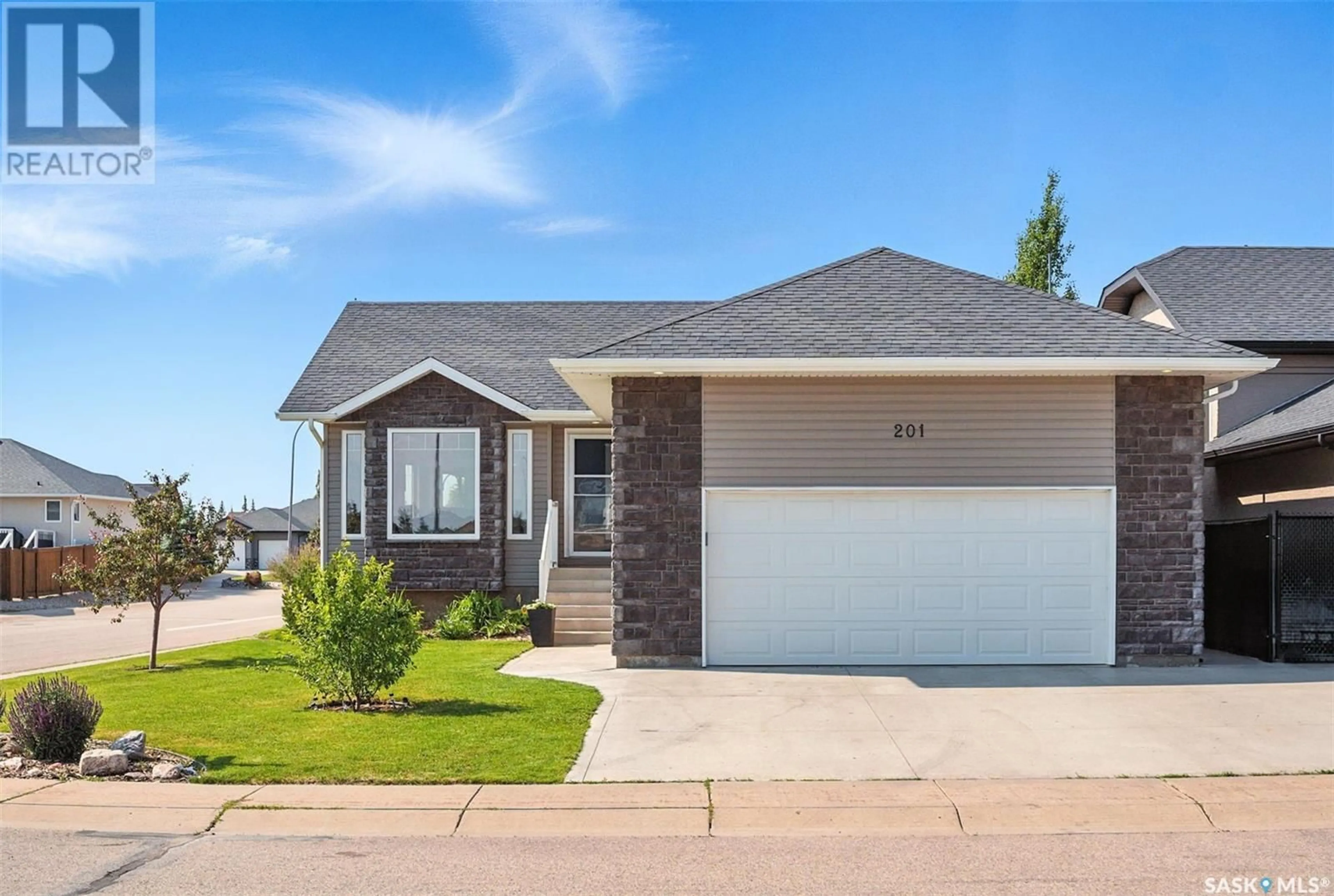 Home with brick exterior material, street for 201 MIZE COURT, Warman Saskatchewan S0K4S1
