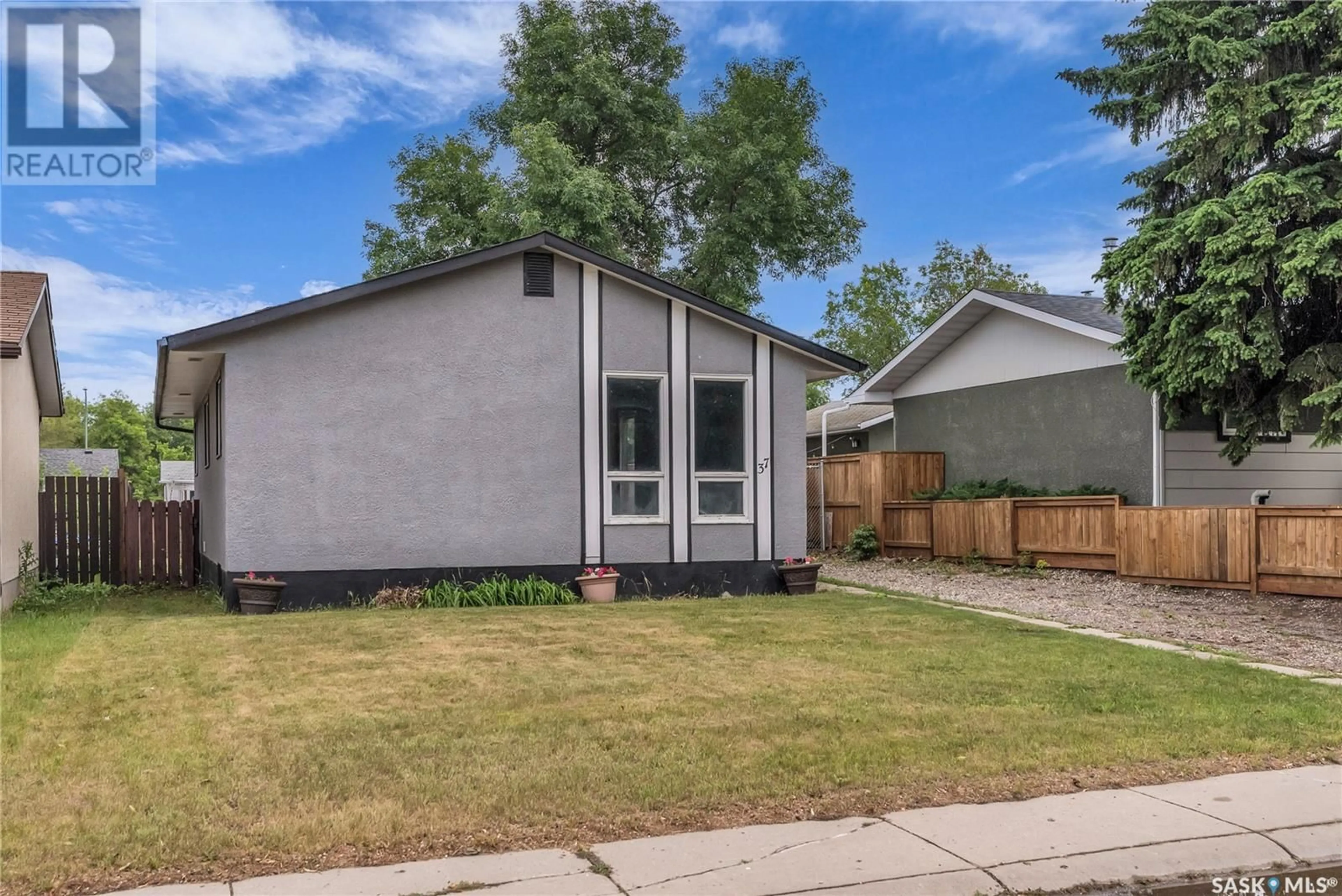 Home with vinyl exterior material, street for 37 POPE CRESCENT, Saskatoon Saskatchewan S7L5K1