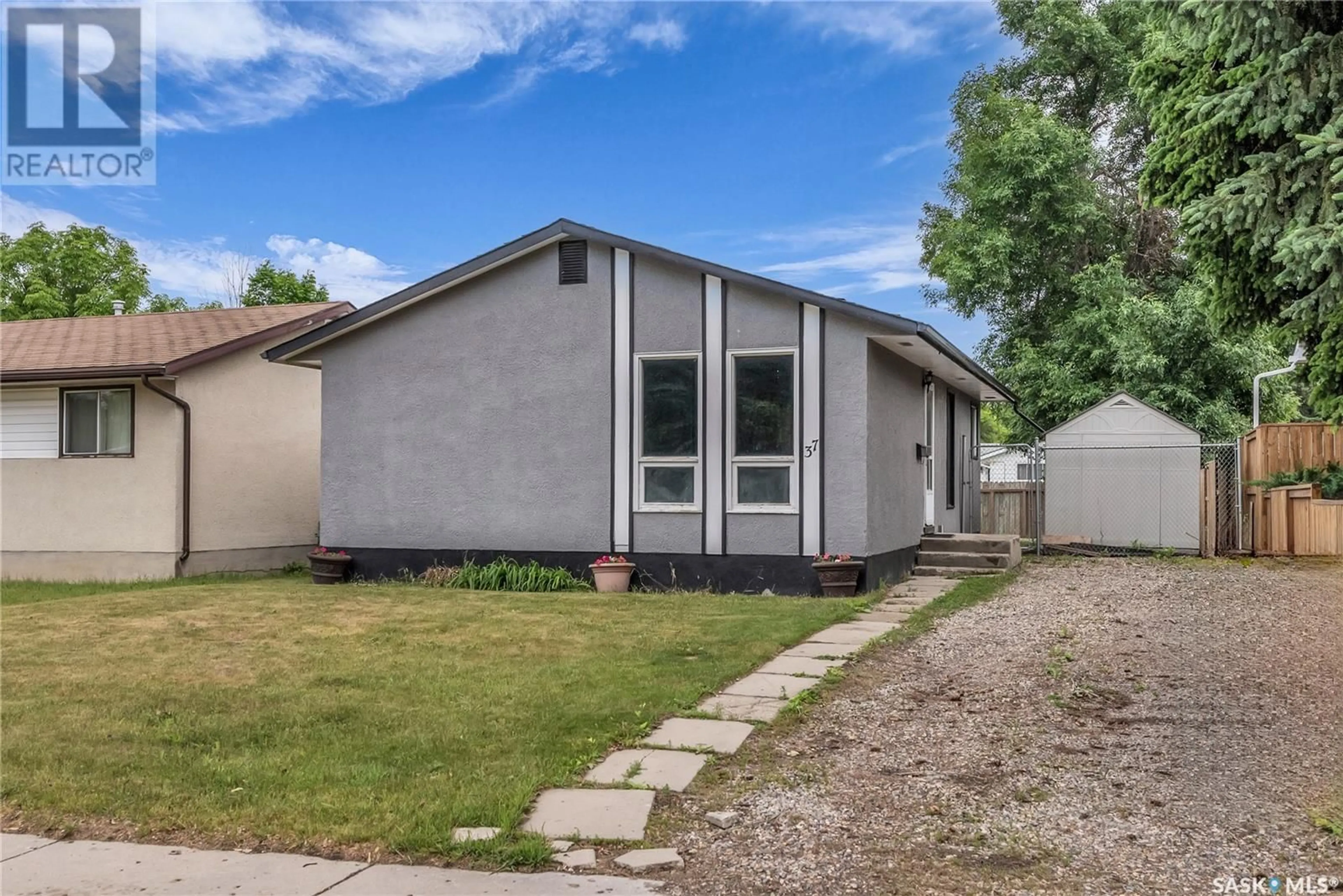 Home with vinyl exterior material, street for 37 POPE CRESCENT, Saskatoon Saskatchewan S7L5K1