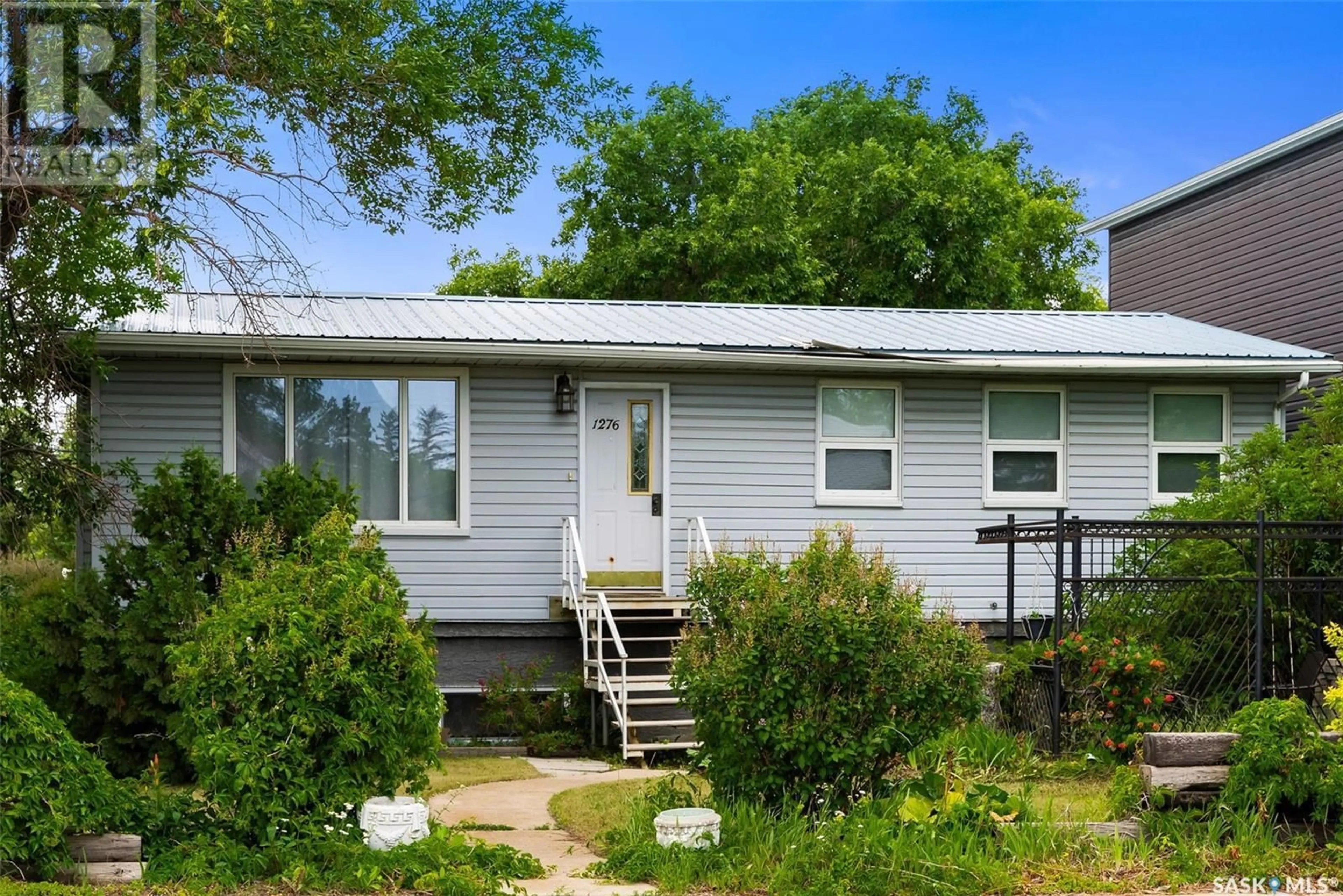 Home with vinyl exterior material, street for A/B - 1276 ELLIOTT STREET, Regina Saskatchewan S4N3G1