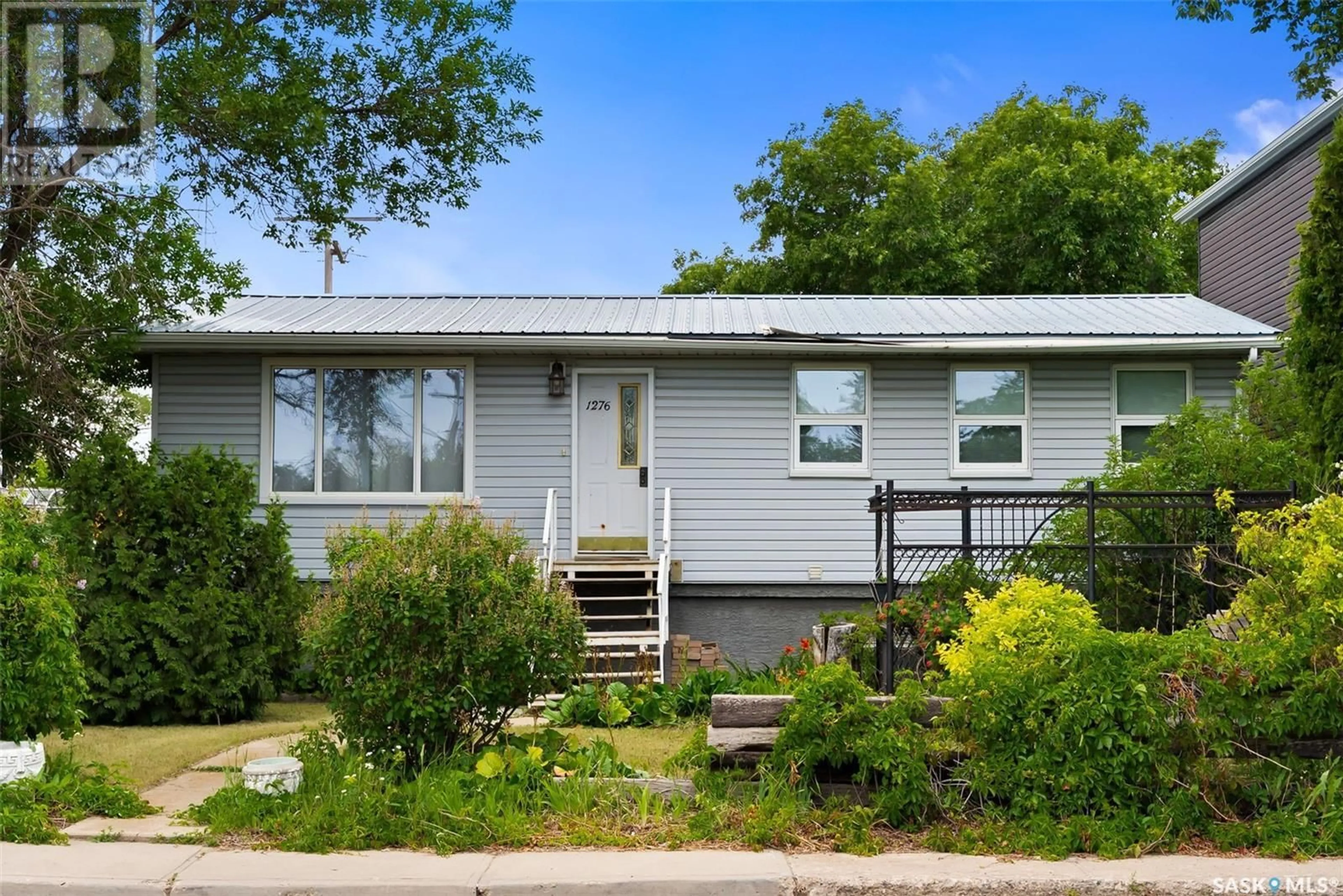 Home with vinyl exterior material, street for A/B - 1276 ELLIOTT STREET, Regina Saskatchewan S4N3G1