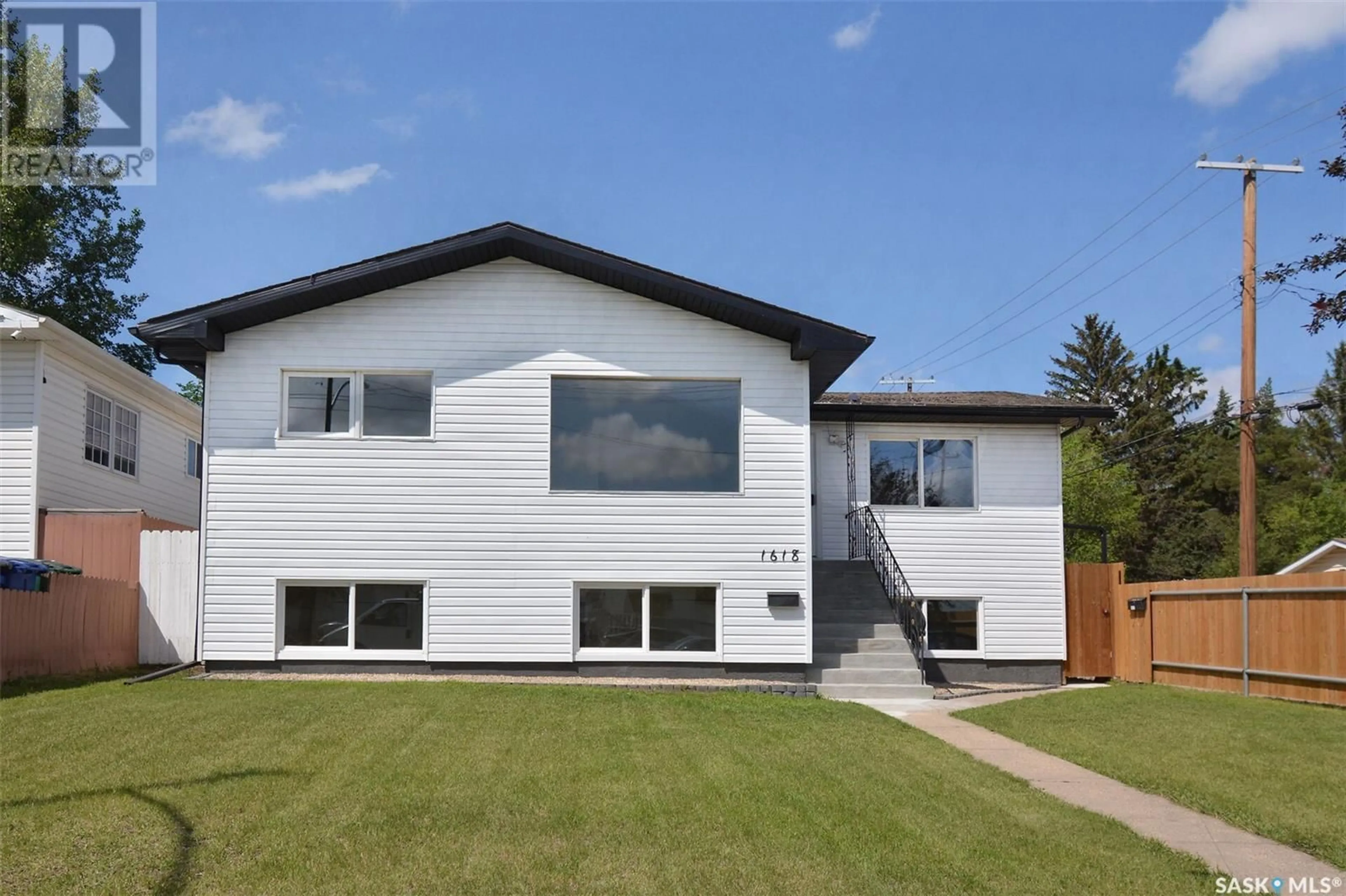 Home with vinyl exterior material, street for 1618 19TH STREET, Saskatoon Saskatchewan S7M1C6