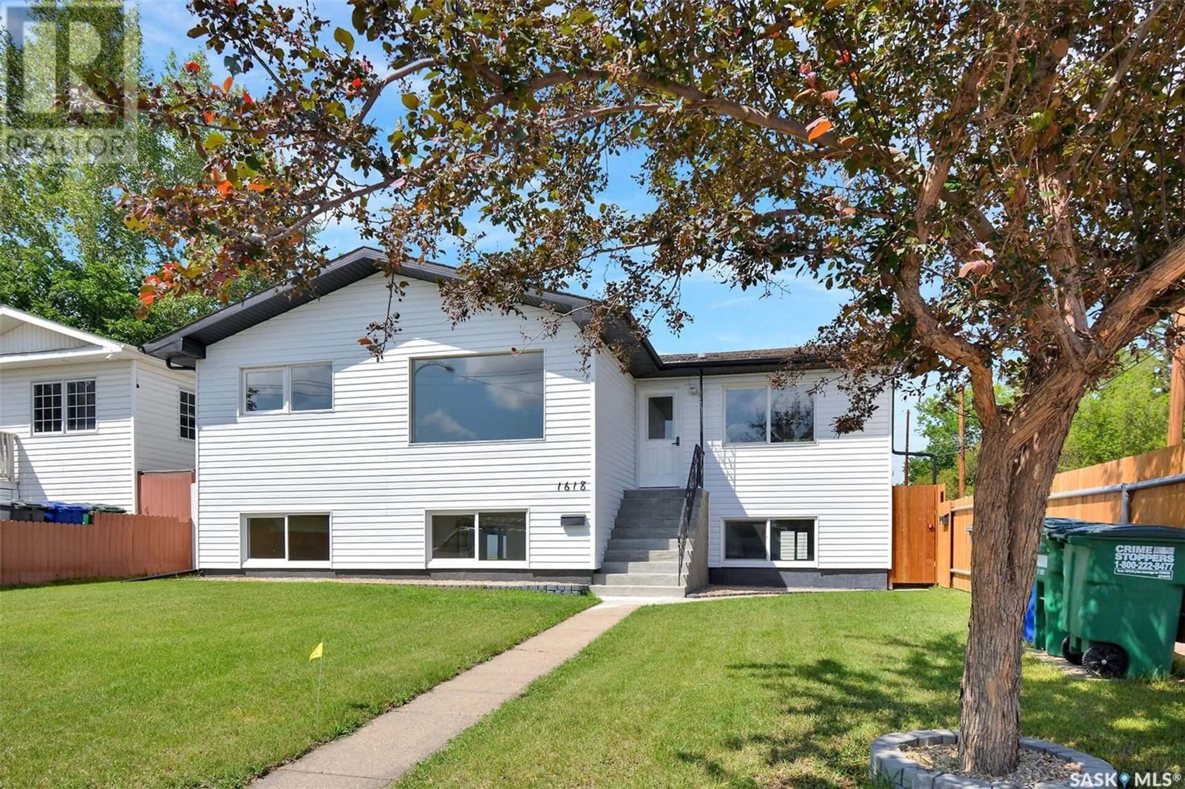 Home with vinyl exterior material, street for 1618 19TH STREET, Saskatoon Saskatchewan S7M1C6