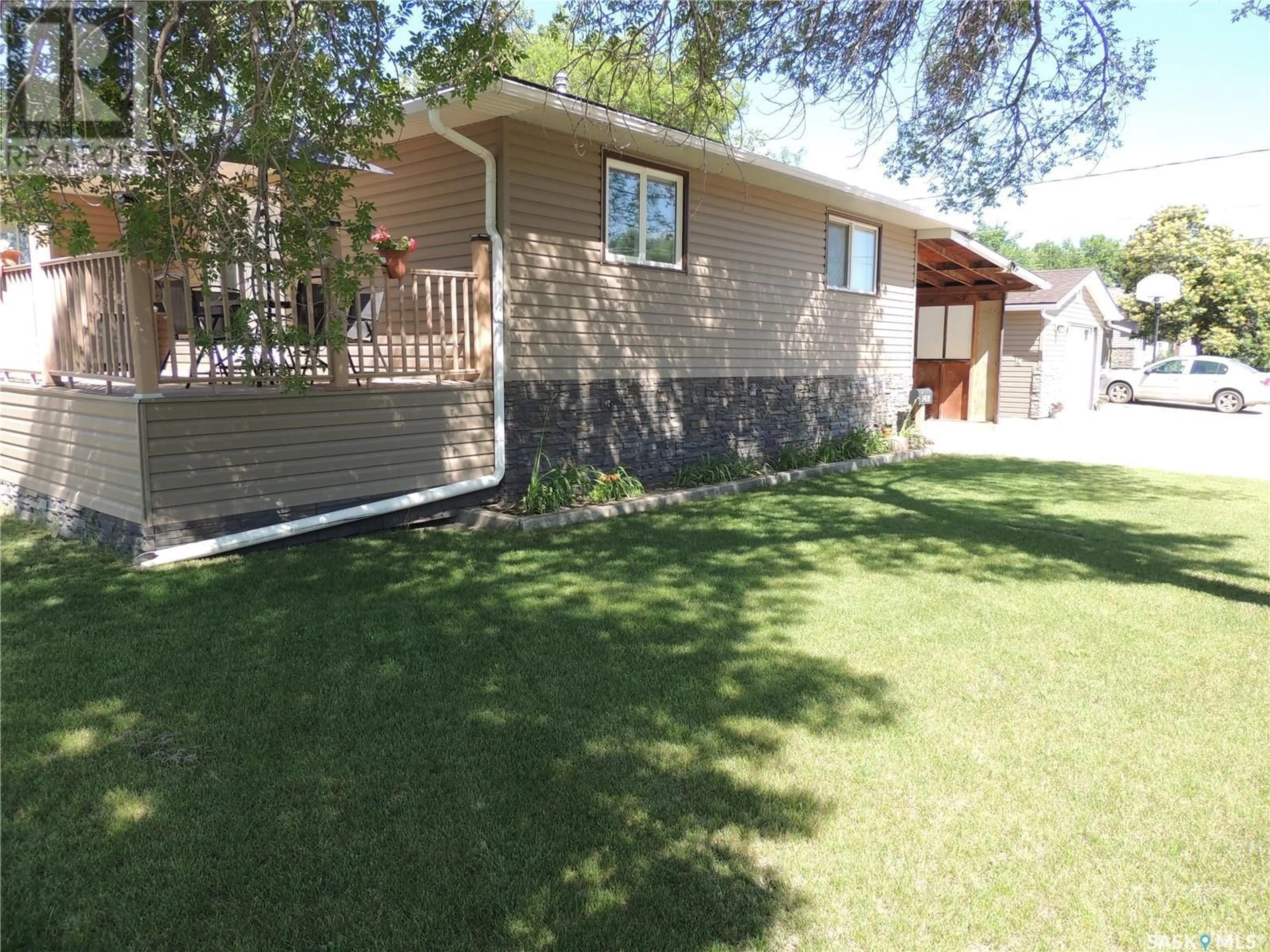 Home with vinyl exterior material, street for 1412 NICHOLSON ROAD, Estevan Saskatchewan S4A1T7