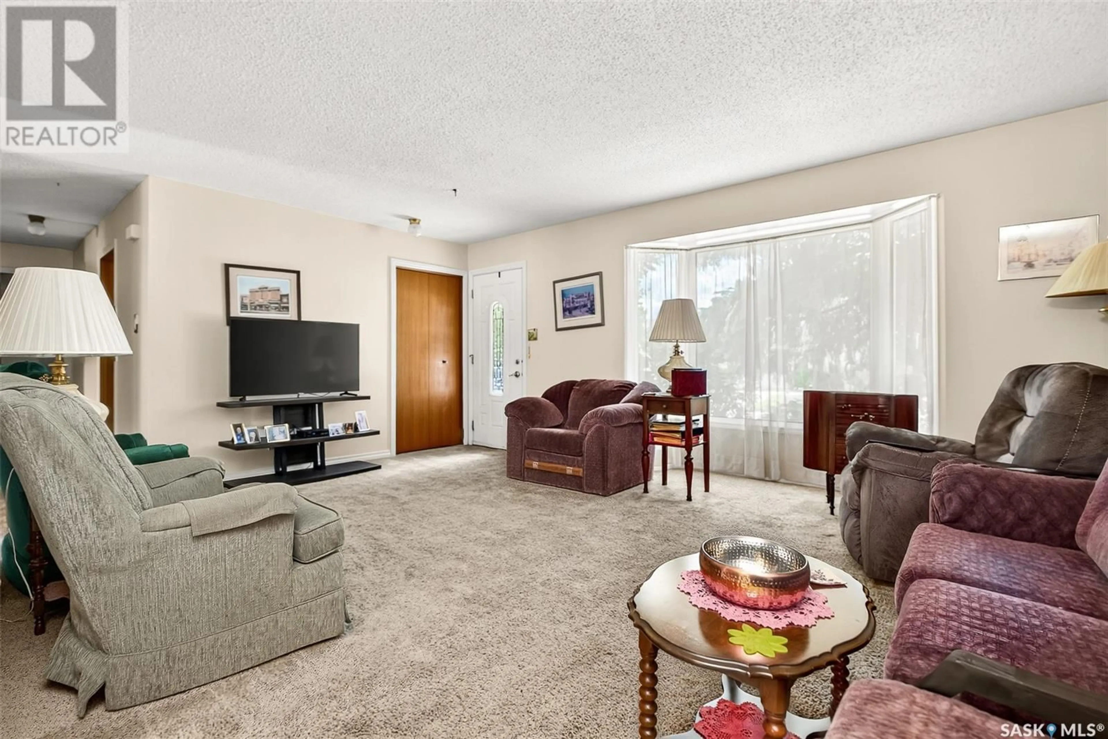 Living room with furniture, carpet floor for 1636 DUNN STREET, Moose Jaw Saskatchewan S6H7B1