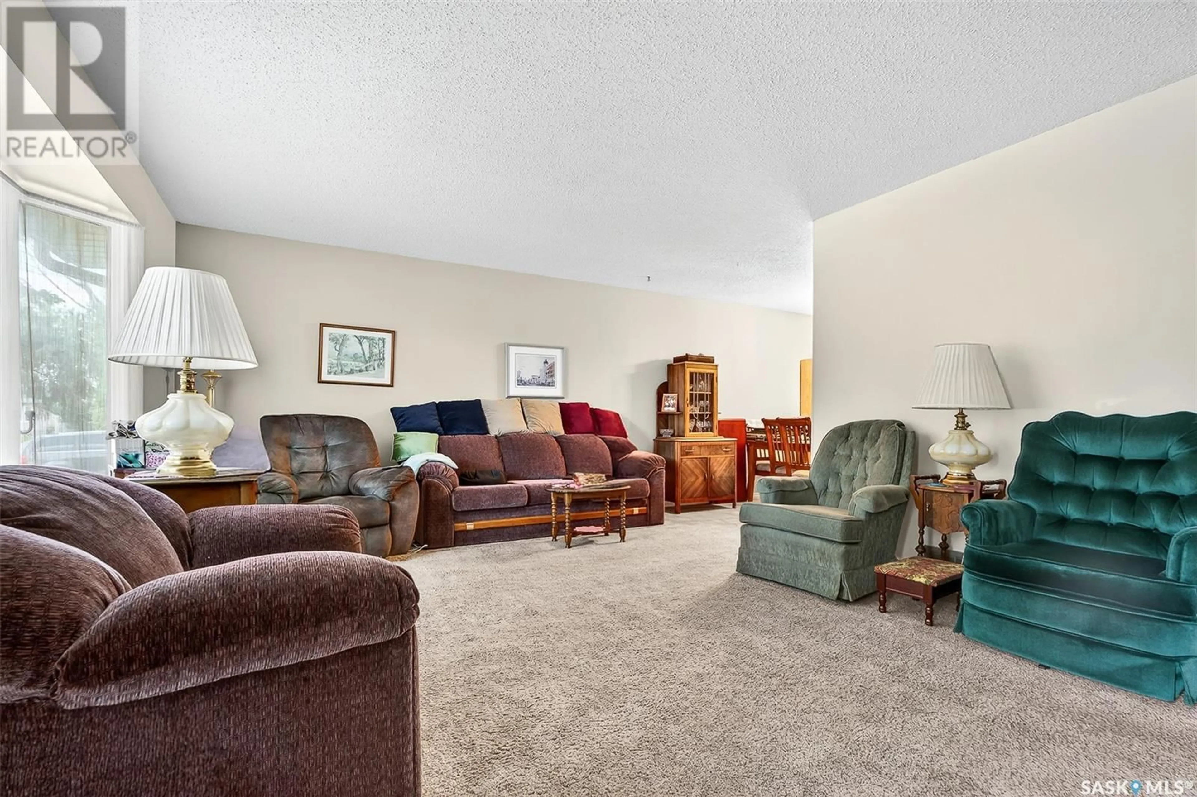 Living room with furniture, carpet floor for 1636 DUNN STREET, Moose Jaw Saskatchewan S6H7B1