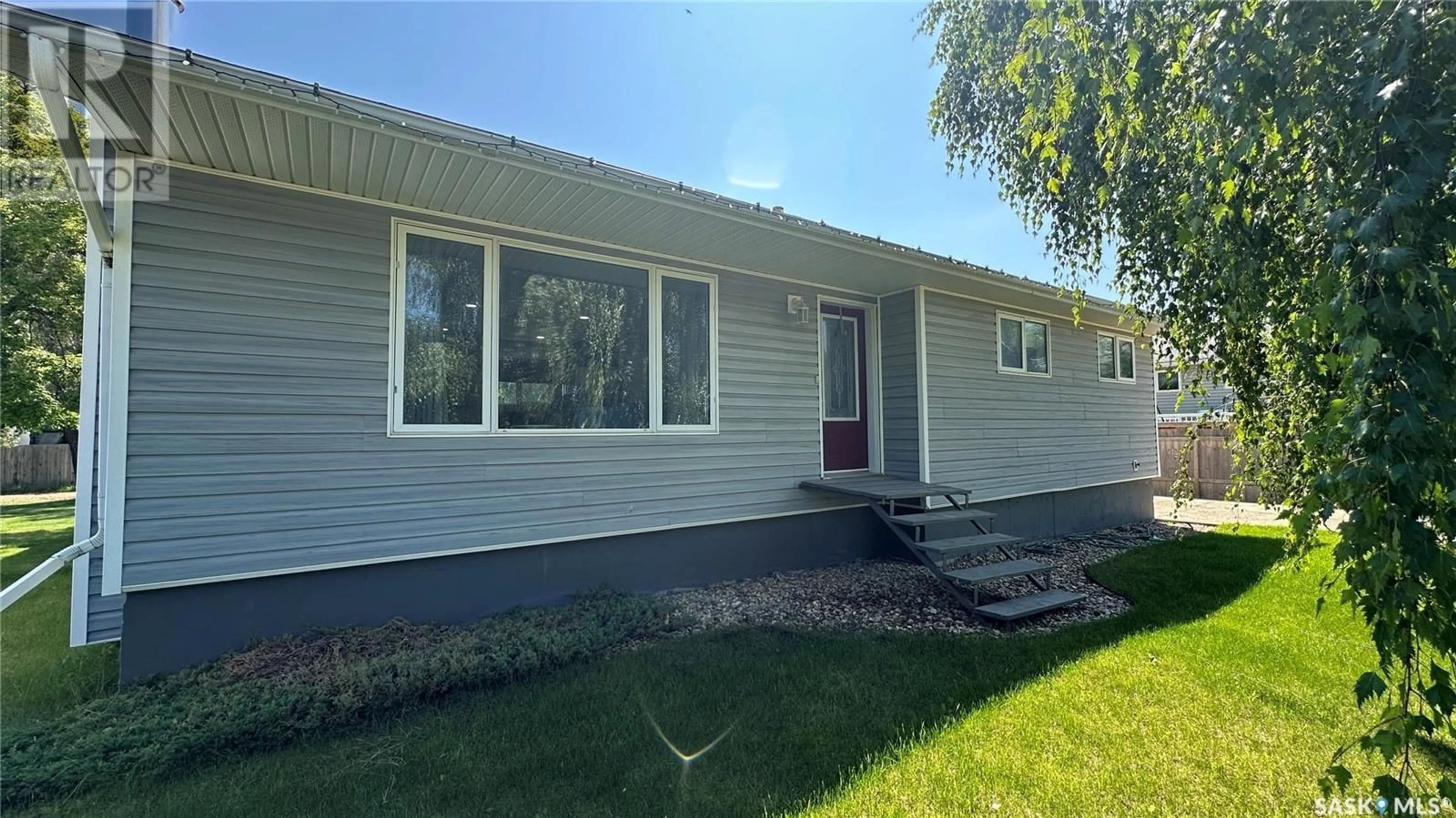 Home with vinyl exterior material, street for 6 VALECREST PLACE, Tisdale Saskatchewan S0E1T0