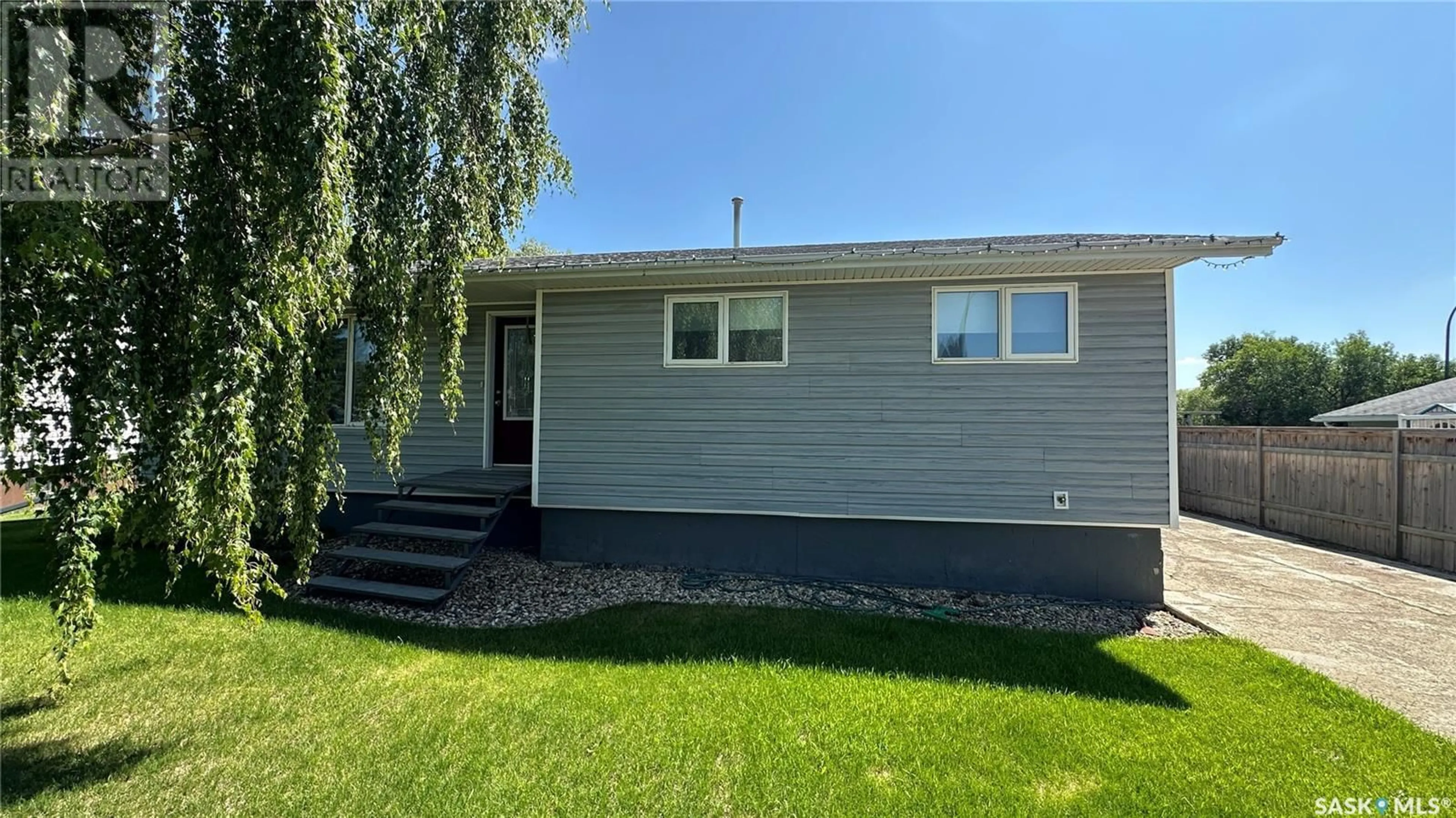 Home with vinyl exterior material, street for 6 VALECREST PLACE, Tisdale Saskatchewan S0E1T0