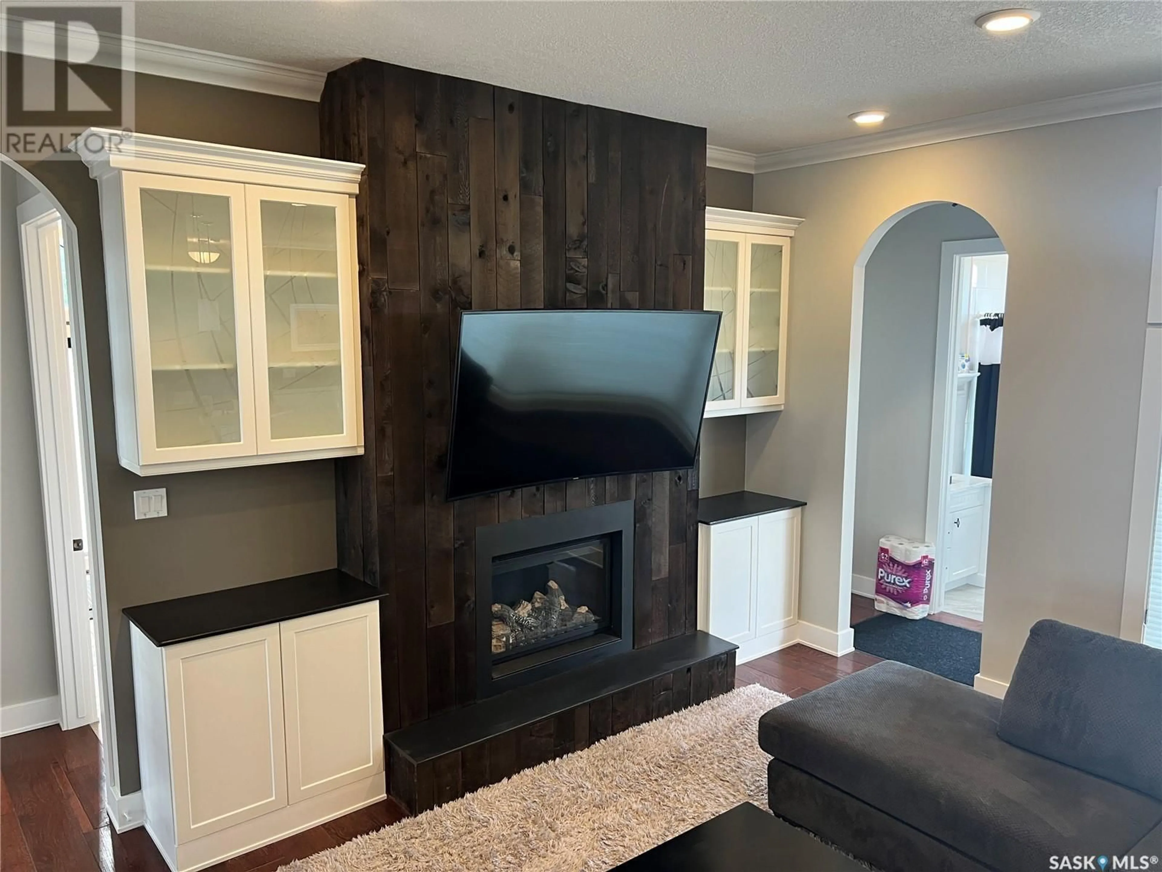 Living room with furniture, wood/laminate floor for NATALIE ACRES, Waldeck Saskatchewan S0H4J0