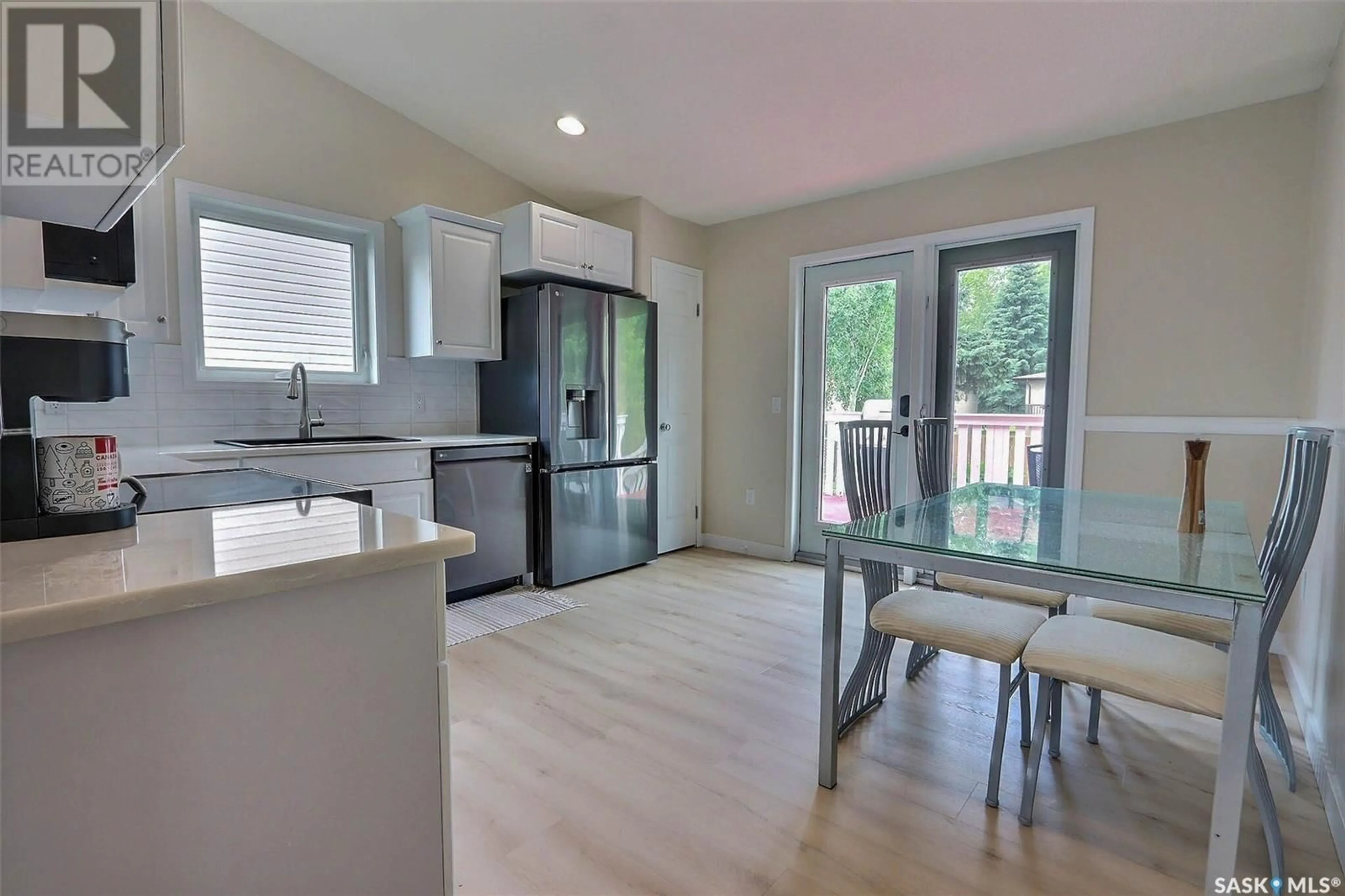 Open concept kitchen, wood/laminate floor for 15 TURNER PLACE, Prince Albert Saskatchewan S6X1C4