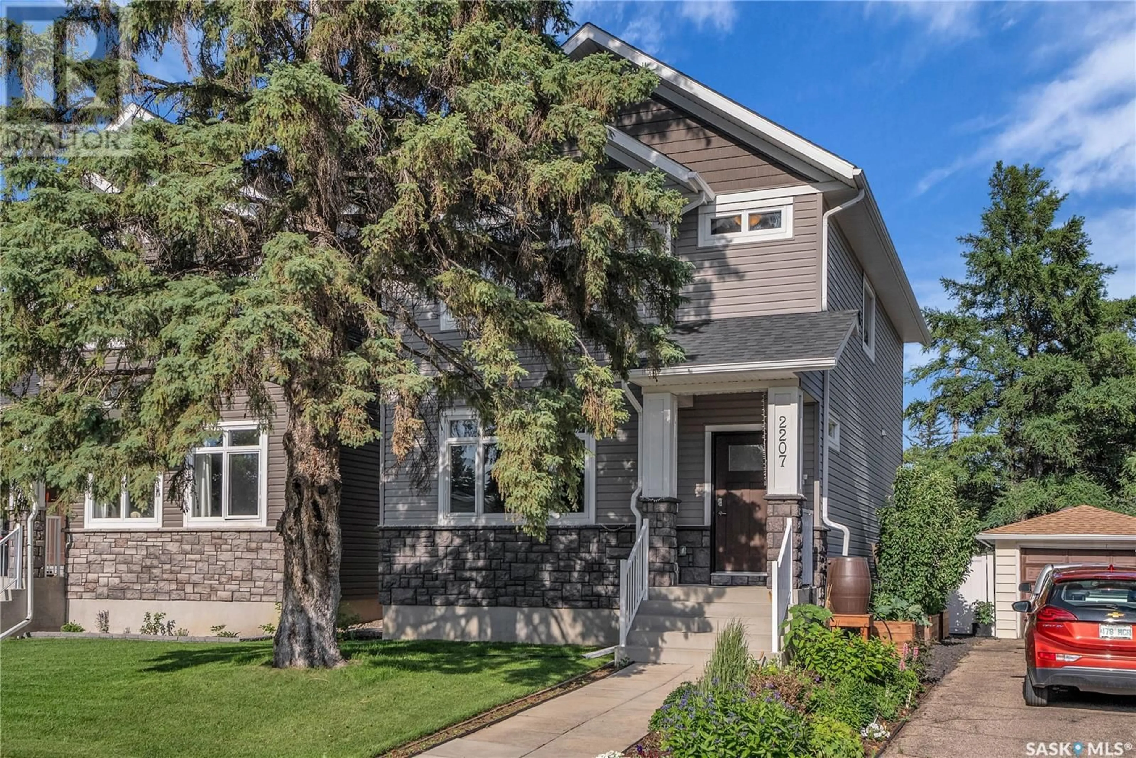 Home with brick exterior material, street for 2207 MUNROE AVENUE, Saskatoon Saskatchewan S7J1S2