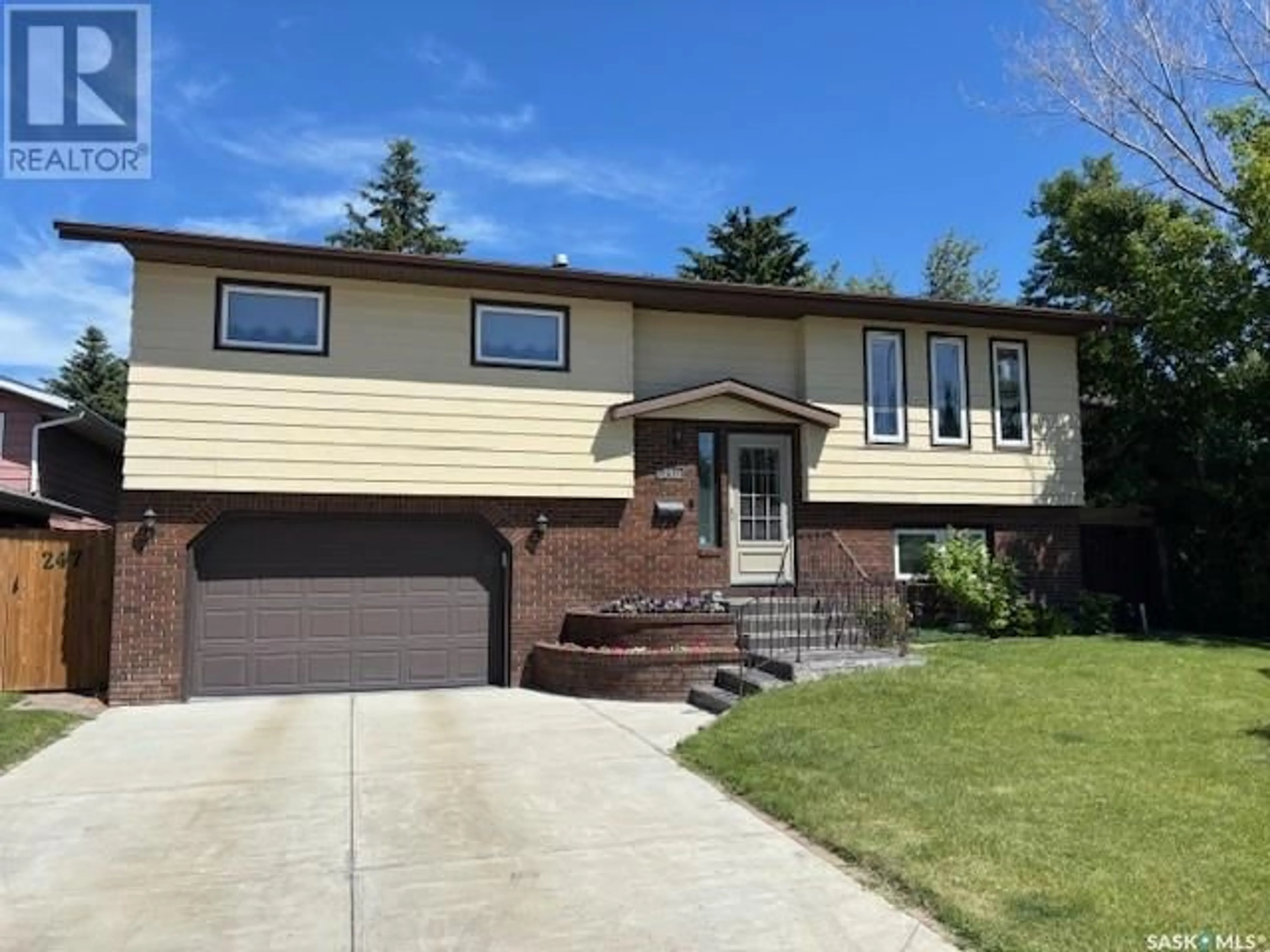 Home with vinyl exterior material, street for 247 WHITECAP CRESCENT, Saskatoon Saskatchewan S7M5C6