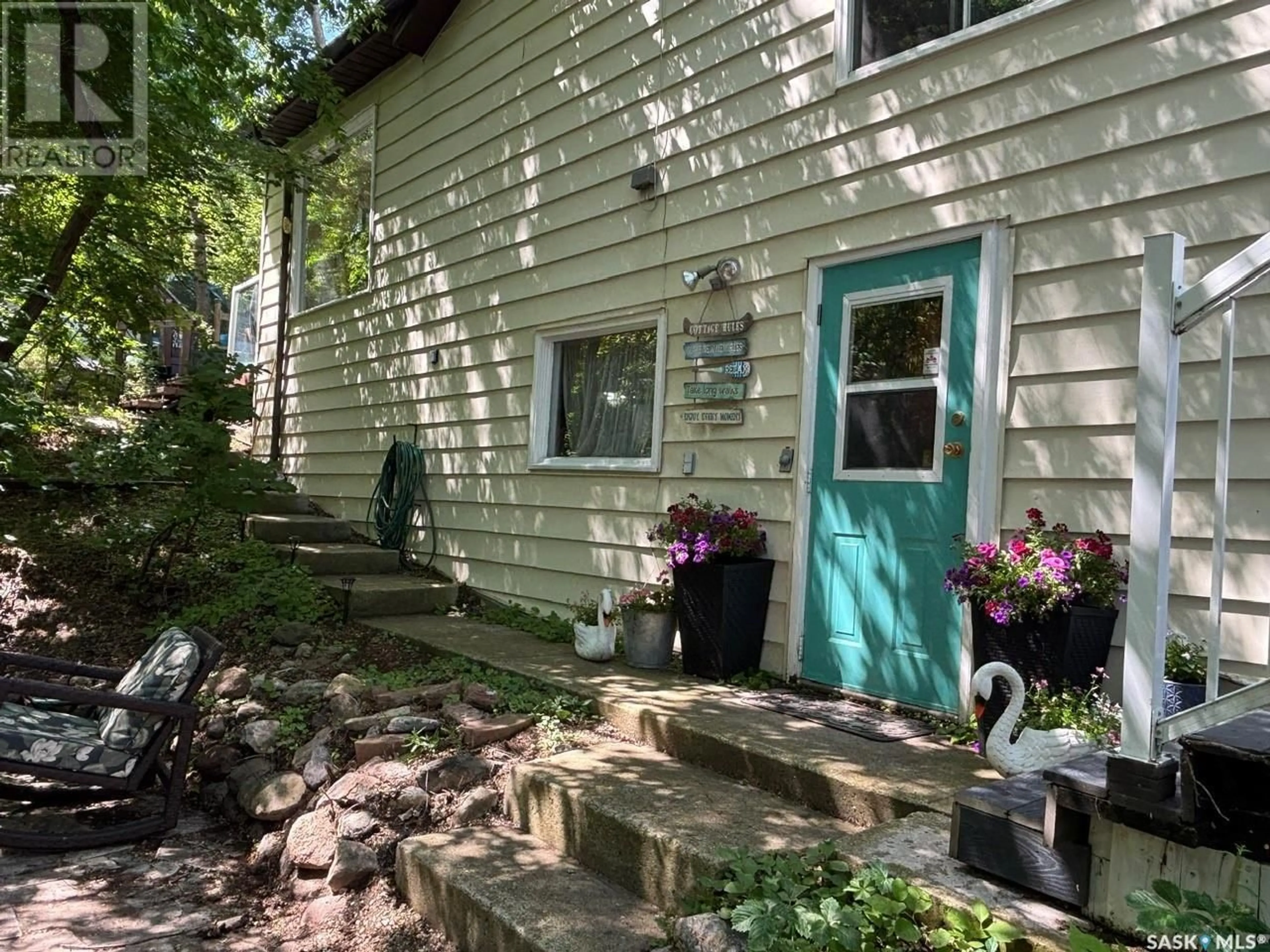 Home with vinyl exterior material, street for 232 GREEN AVENUE, Regina Beach Saskatchewan S0G4C0