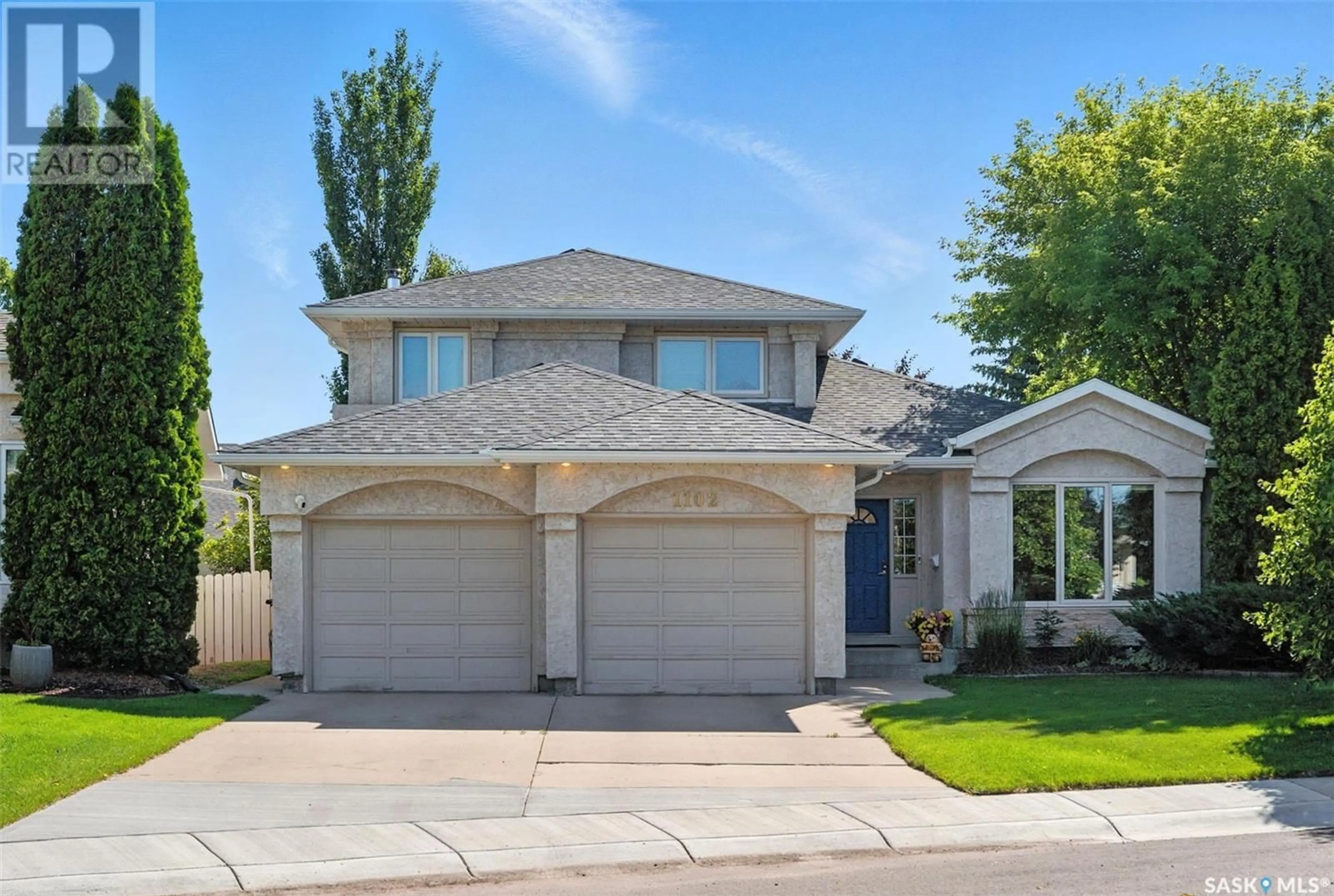 Home with vinyl exterior material, street for 1102 HURLEY WAY, Saskatoon Saskatchewan S7N4J7