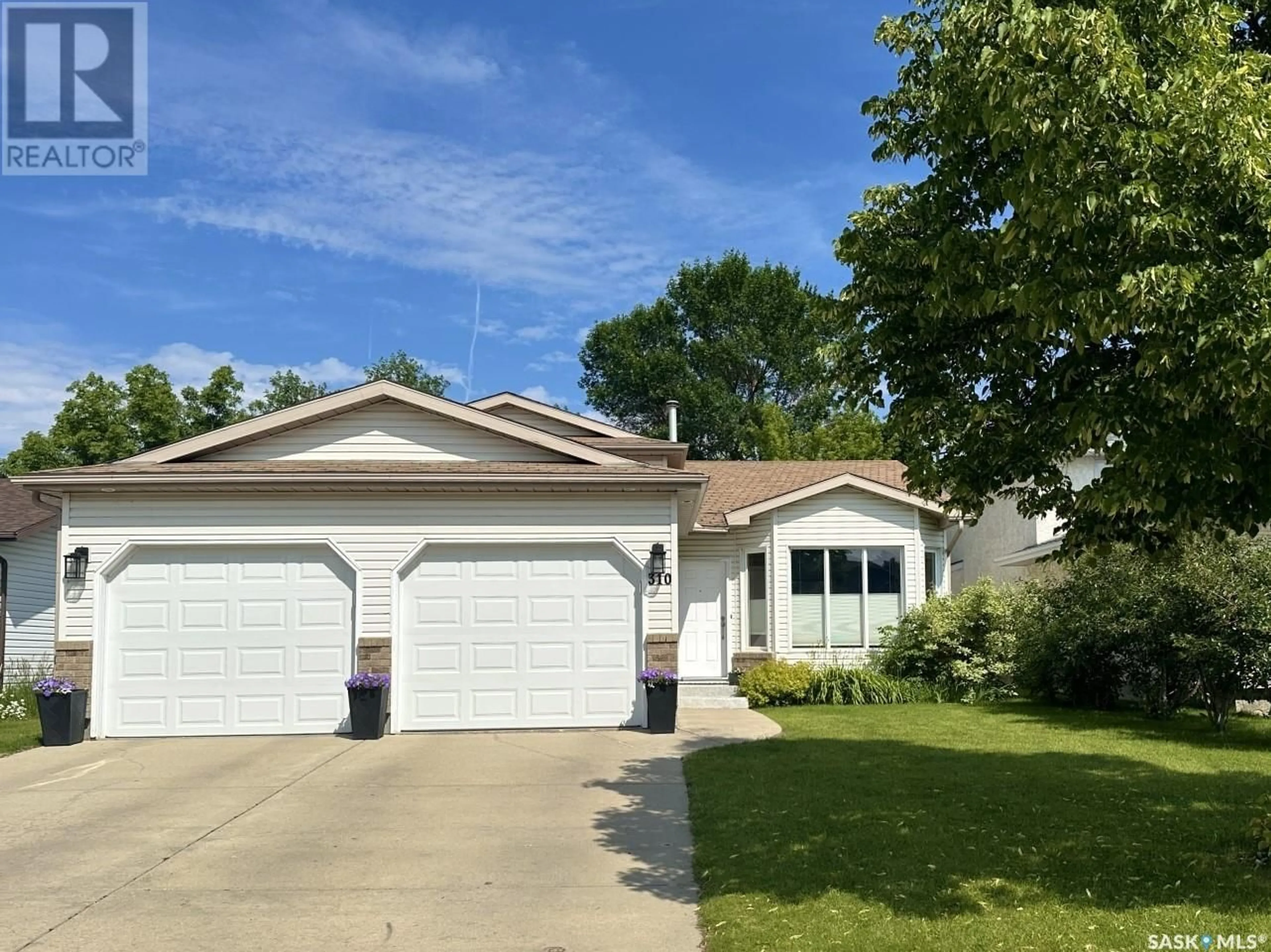 Home with vinyl exterior material, street for 310 COBEN CRESCENT, Saskatoon Saskatchewan S7S1B3