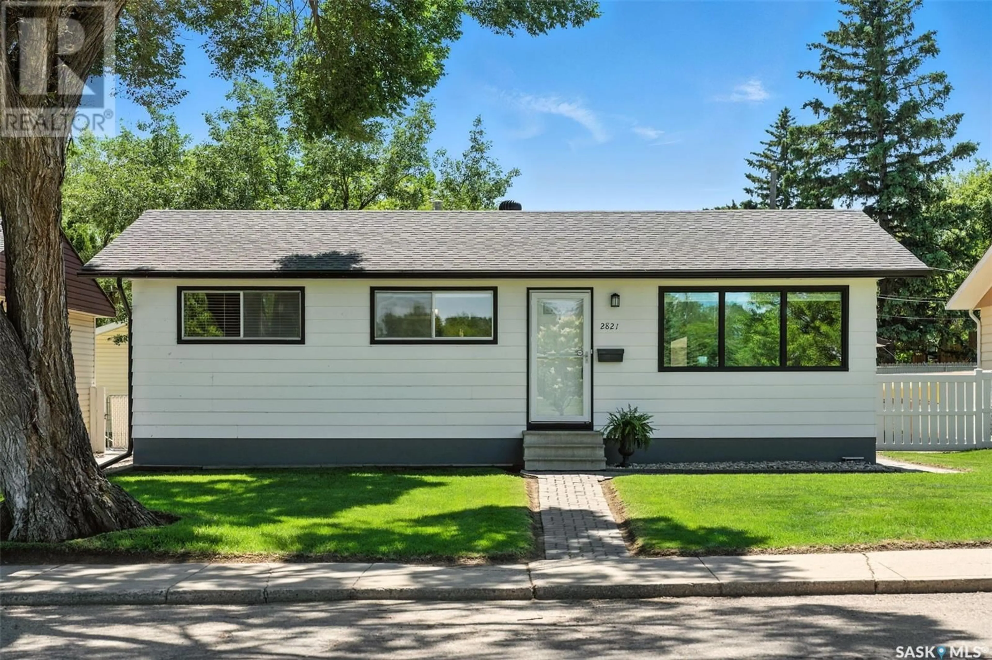 Home with vinyl exterior material, street for 2821 RUSHOLME ROAD, Saskatoon Saskatchewan S7L0H3