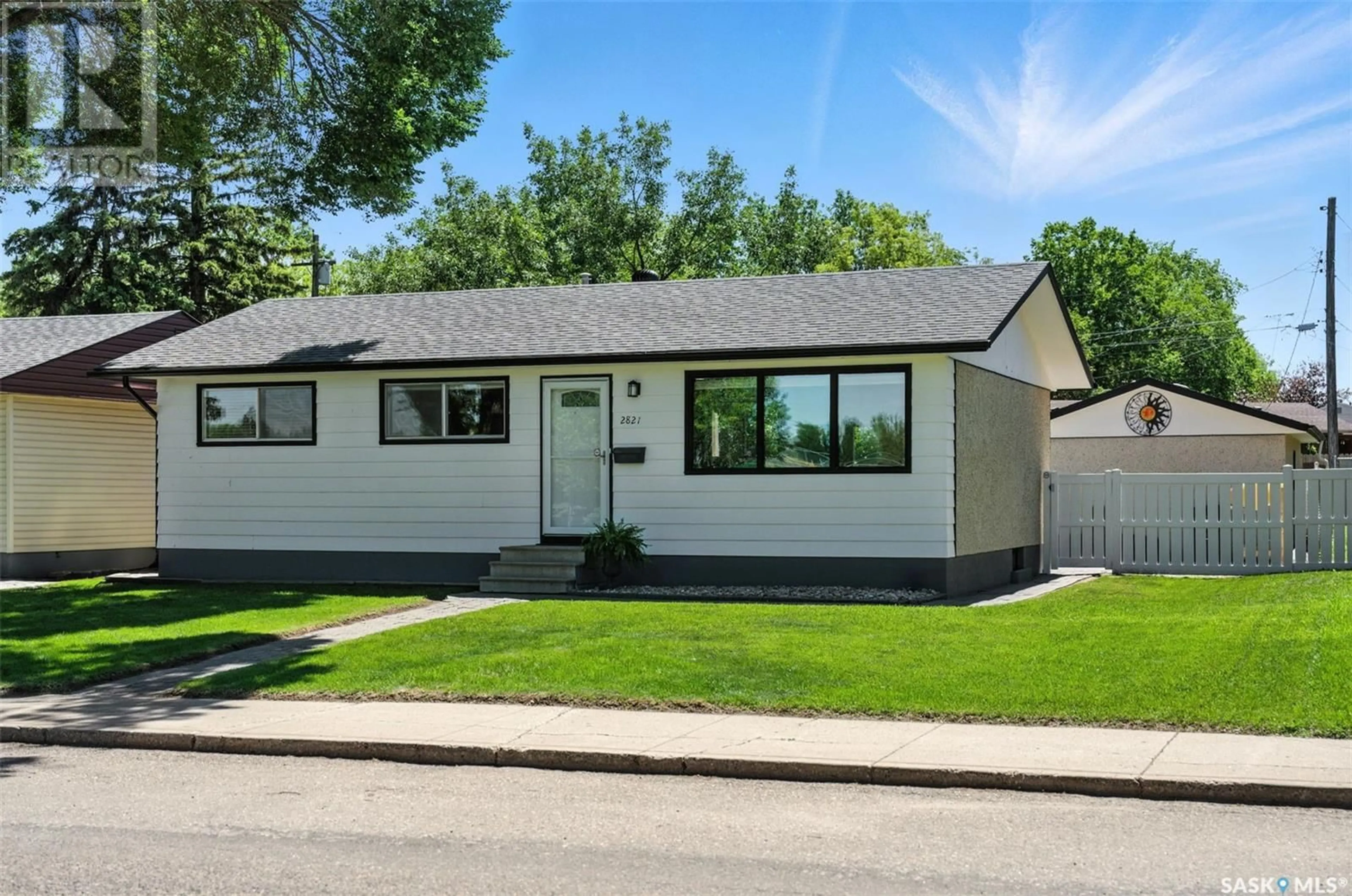Home with vinyl exterior material, street for 2821 RUSHOLME ROAD, Saskatoon Saskatchewan S7L0H3
