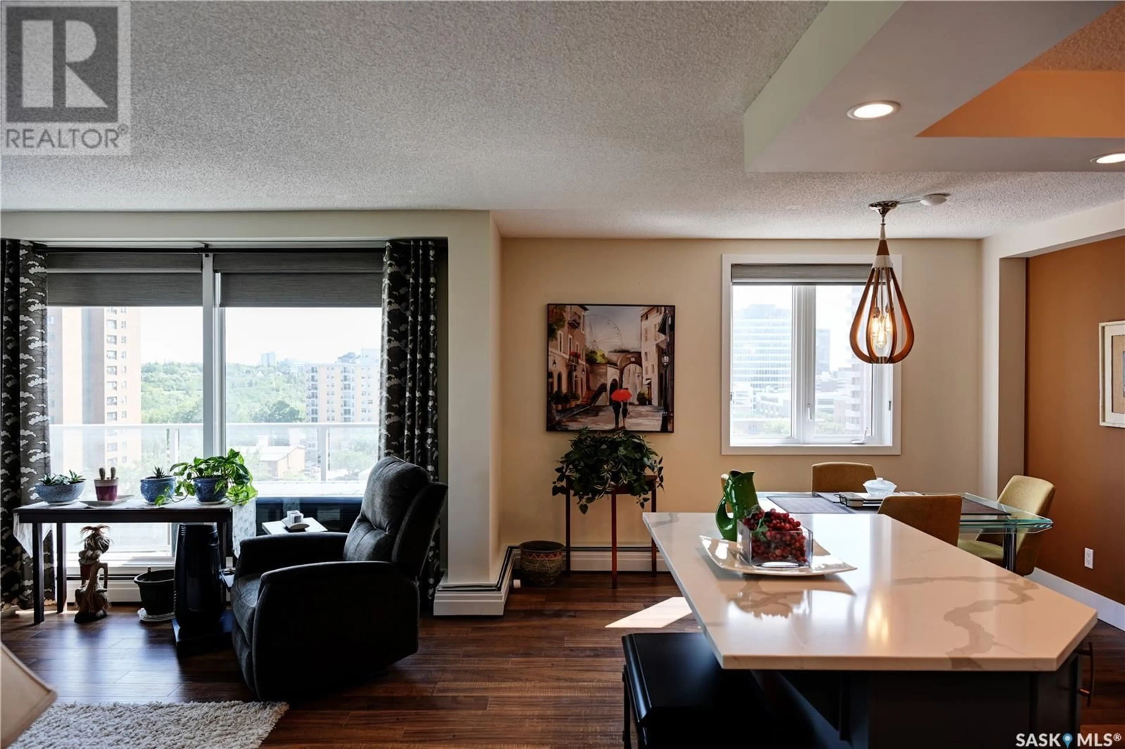 Living room with furniture, wood/laminate floor for 320 - 1106 5TH AVENUE, Saskatoon Saskatchewan S7K2P5