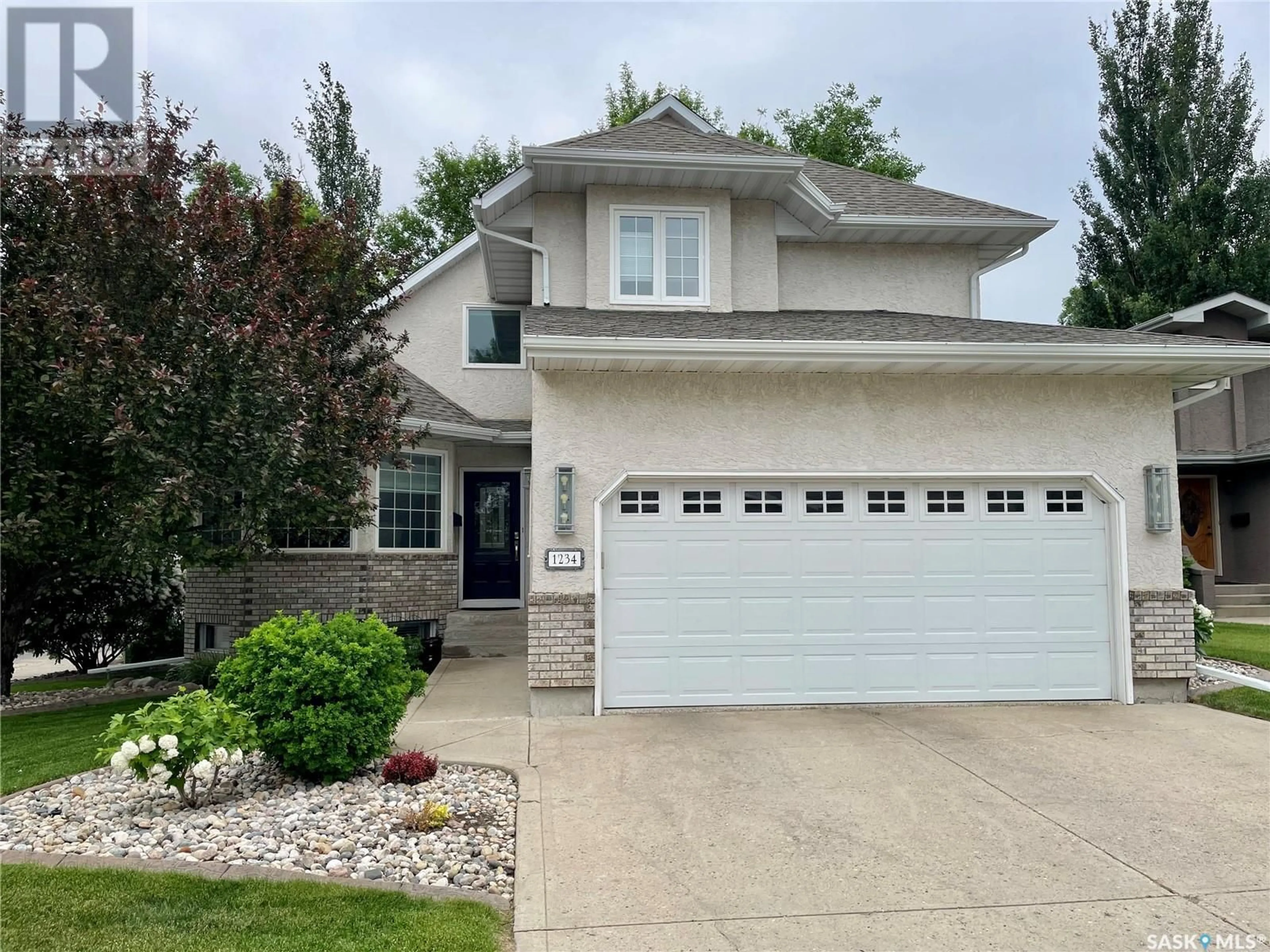 Home with vinyl exterior material, street for 1234 YOUNGSON PLACE, Regina Saskatchewan S4X4K4