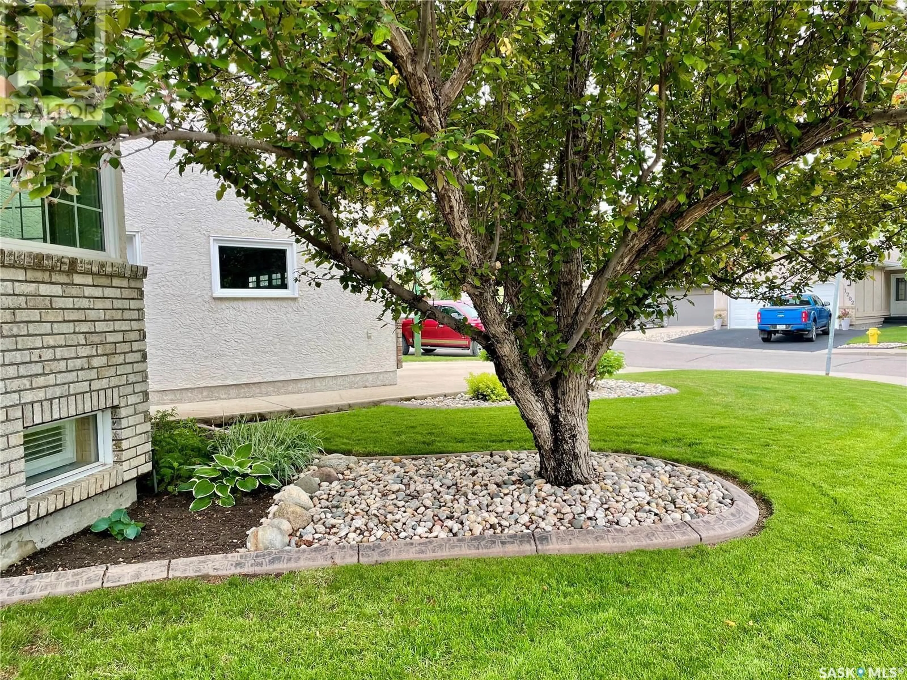 A pic from outside/outdoor area/front of a property/back of a property/a pic from drone, street for 1234 YOUNGSON PLACE, Regina Saskatchewan S4X4K4