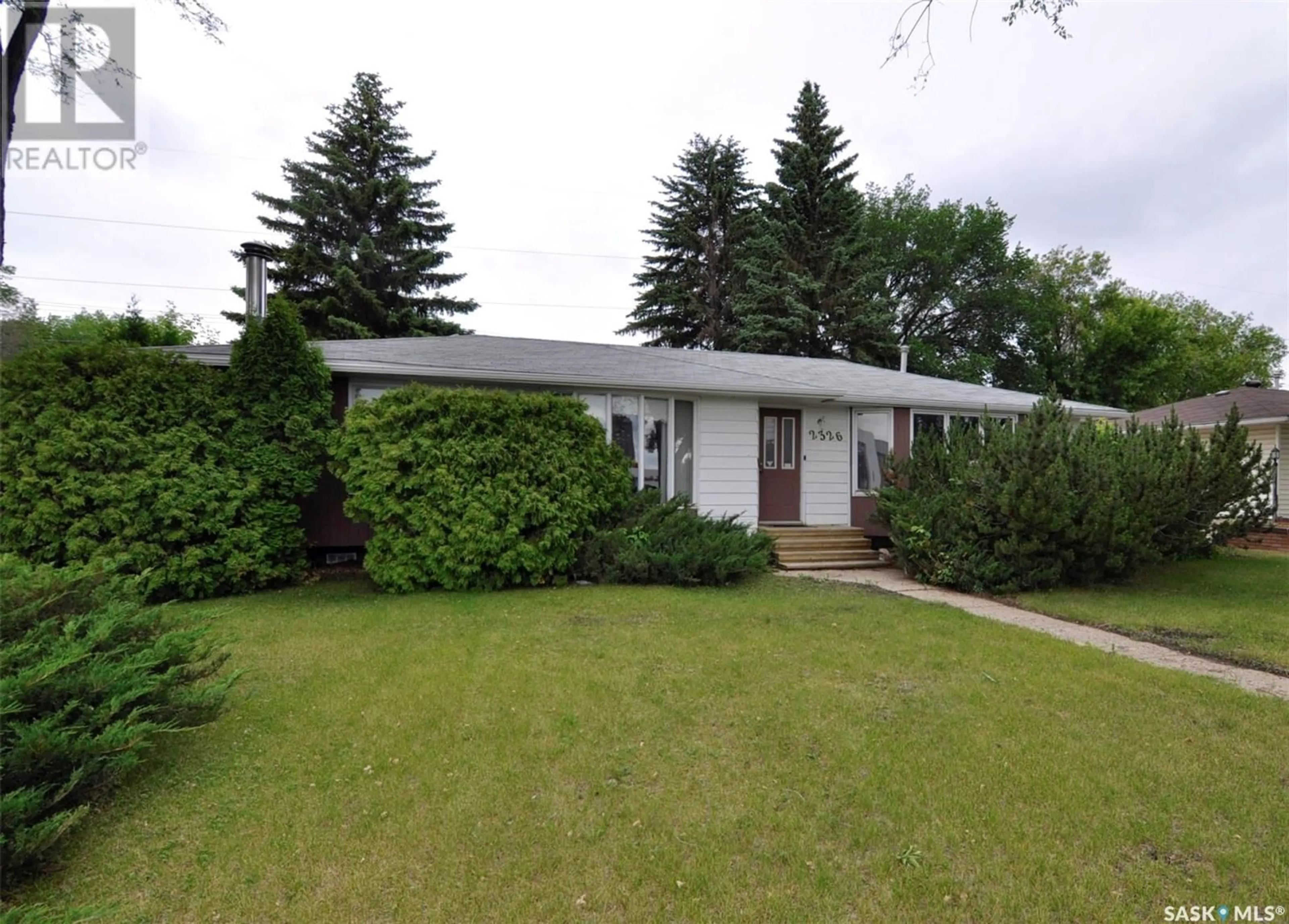 Home with vinyl exterior material, street for 2326 PRESTON AVENUE, Saskatoon Saskatchewan S7J2G2