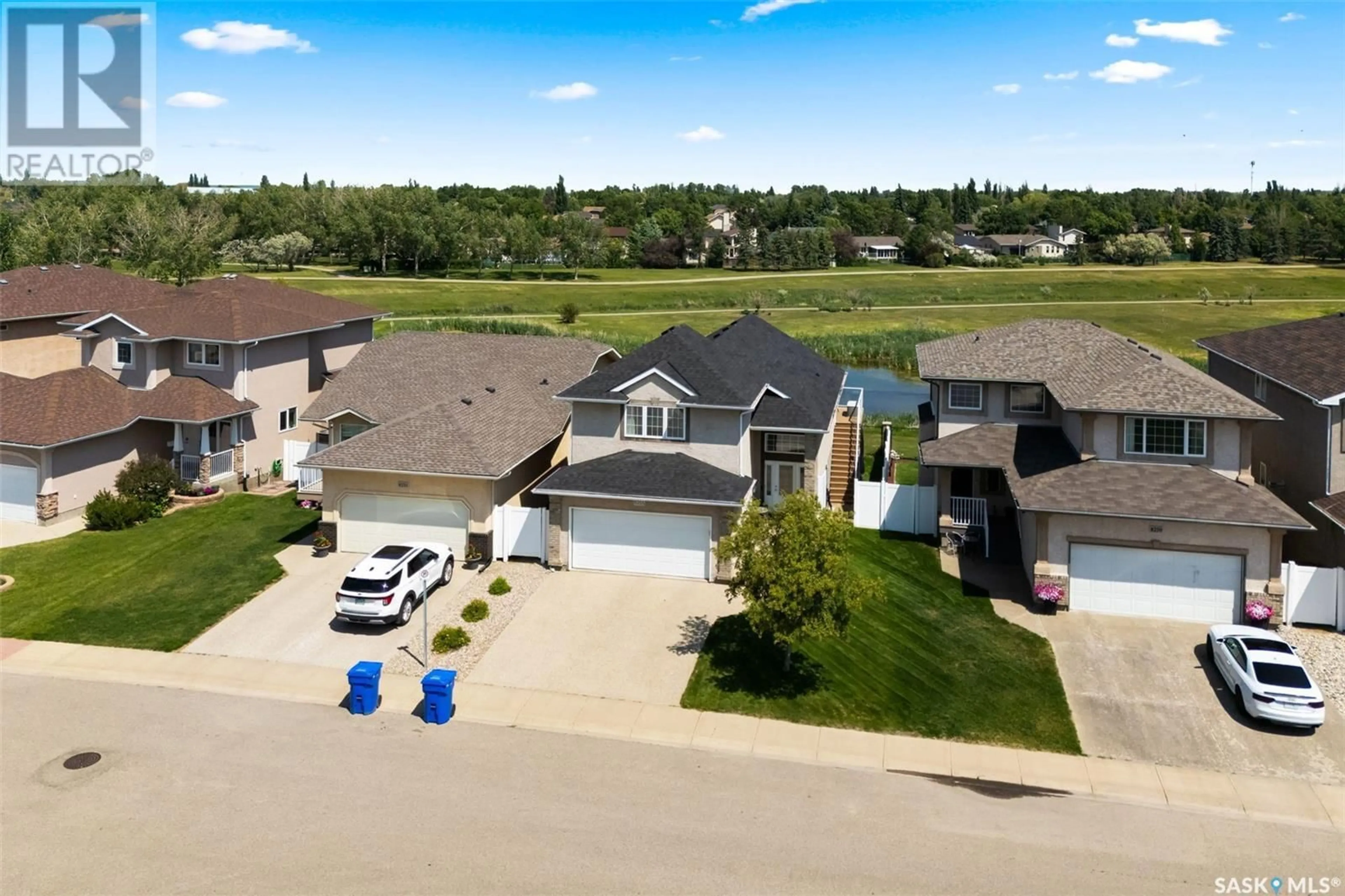 A pic from outside/outdoor area/front of a property/back of a property/a pic from drone, street for 8255 FAIRWAYS WEST DRIVE, Regina Saskatchewan S4Y0A1
