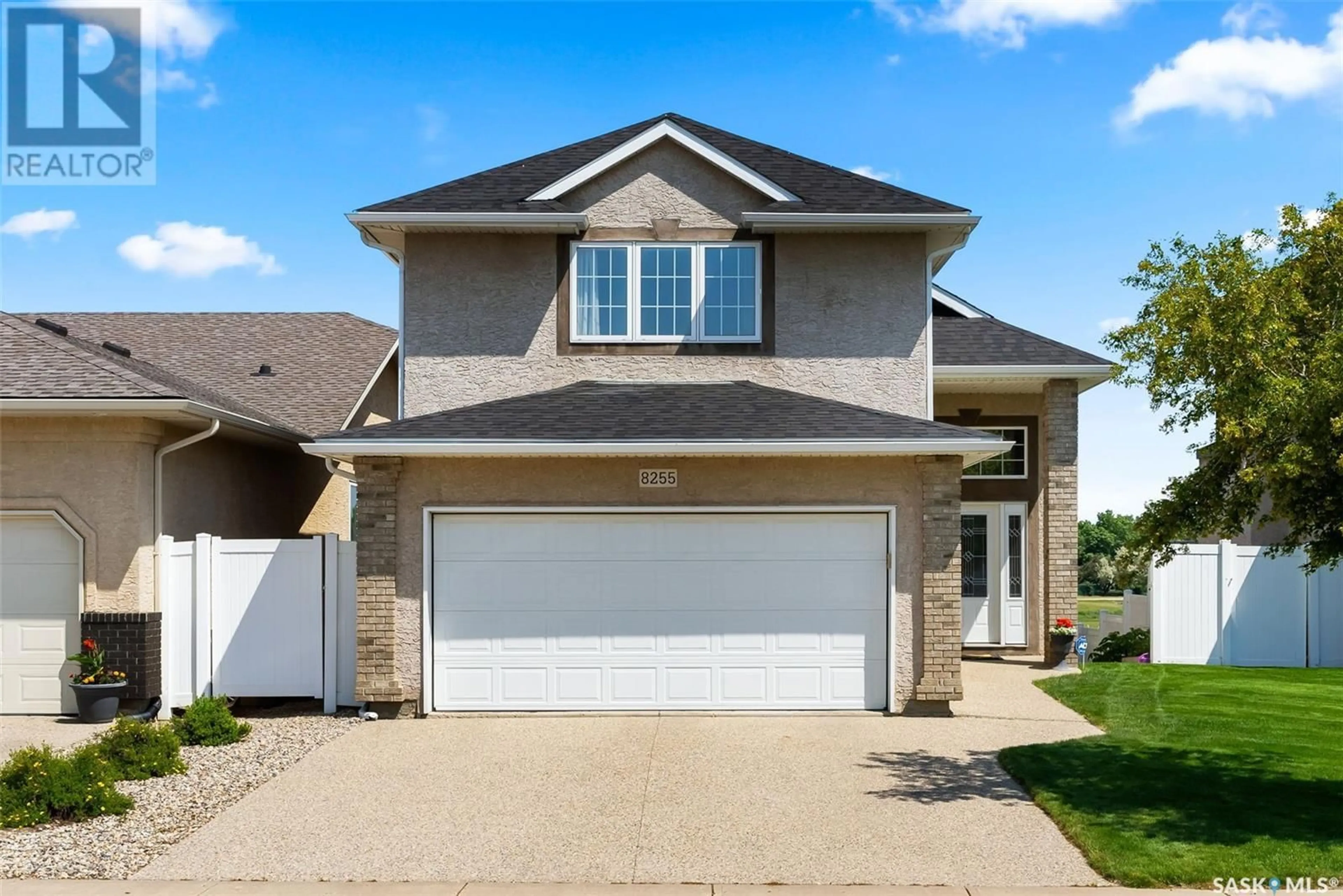 Home with vinyl exterior material, street for 8255 FAIRWAYS WEST DRIVE, Regina Saskatchewan S4Y0A1
