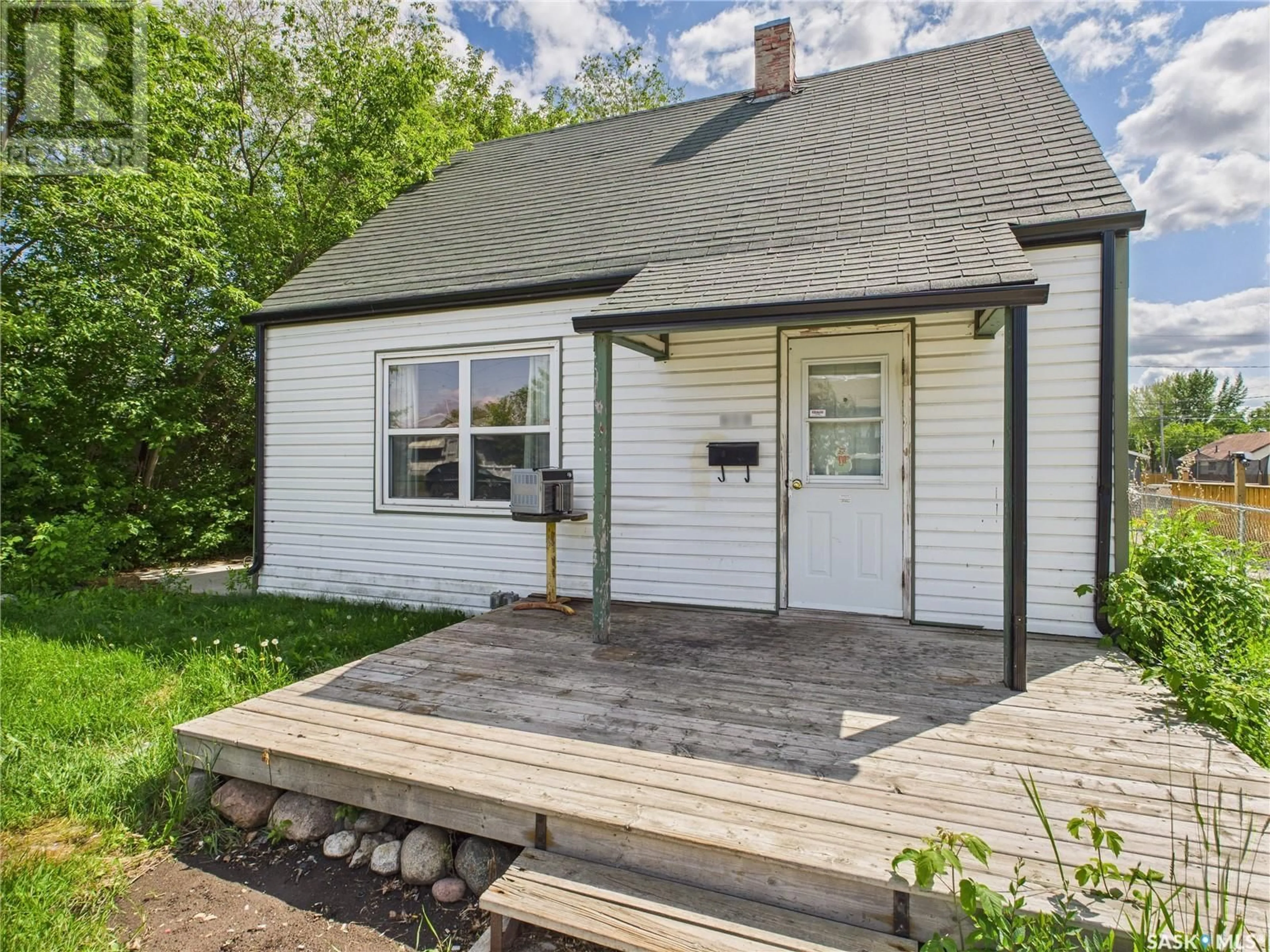 Home with vinyl exterior material, street for 619 7TH STREET, Prince Albert Saskatchewan S6V0S7