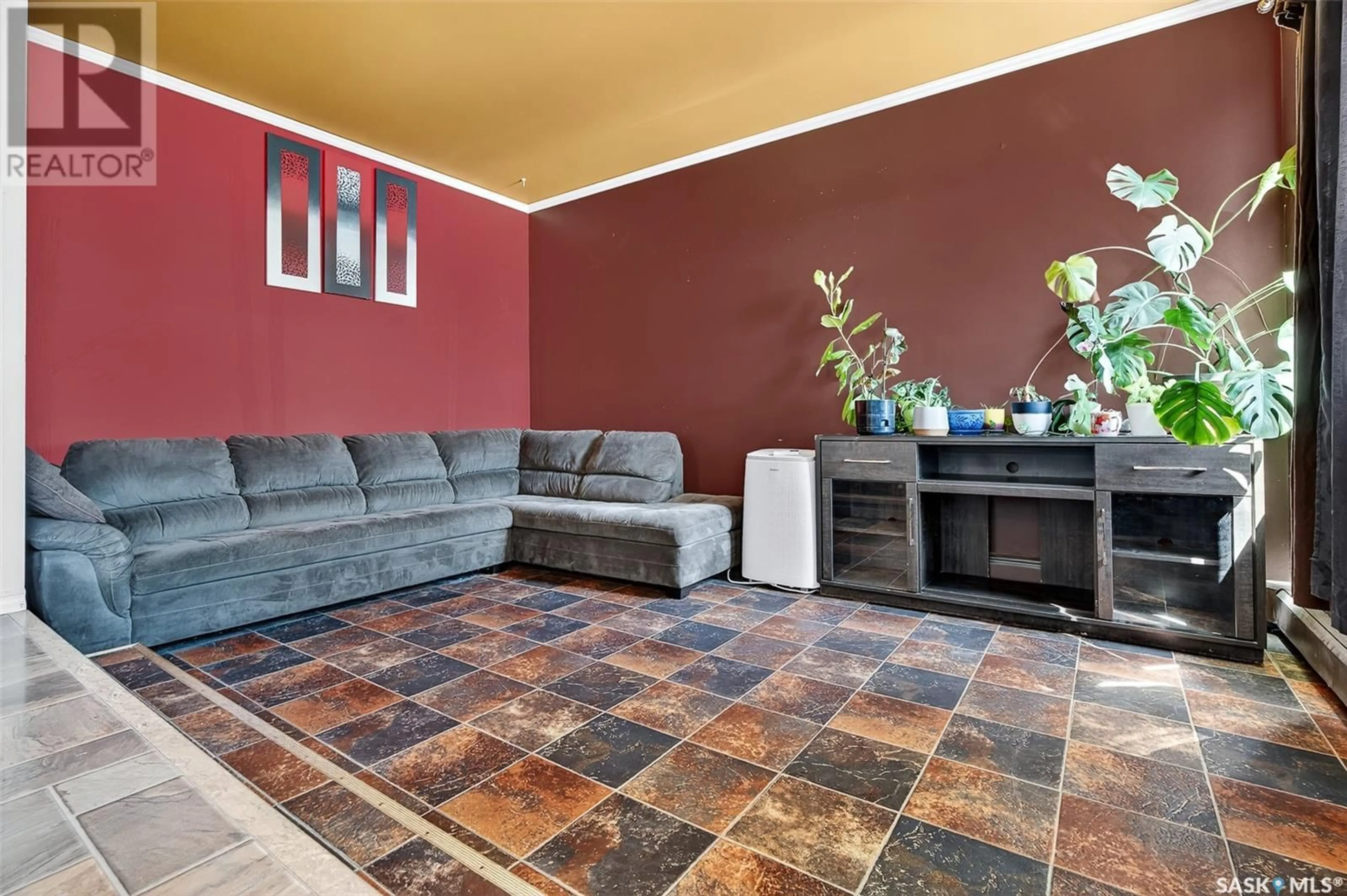Living room with furniture, ceramic/tile floor for 1042 MONTGOMERY STREET, Moose Jaw Saskatchewan S6H2X1