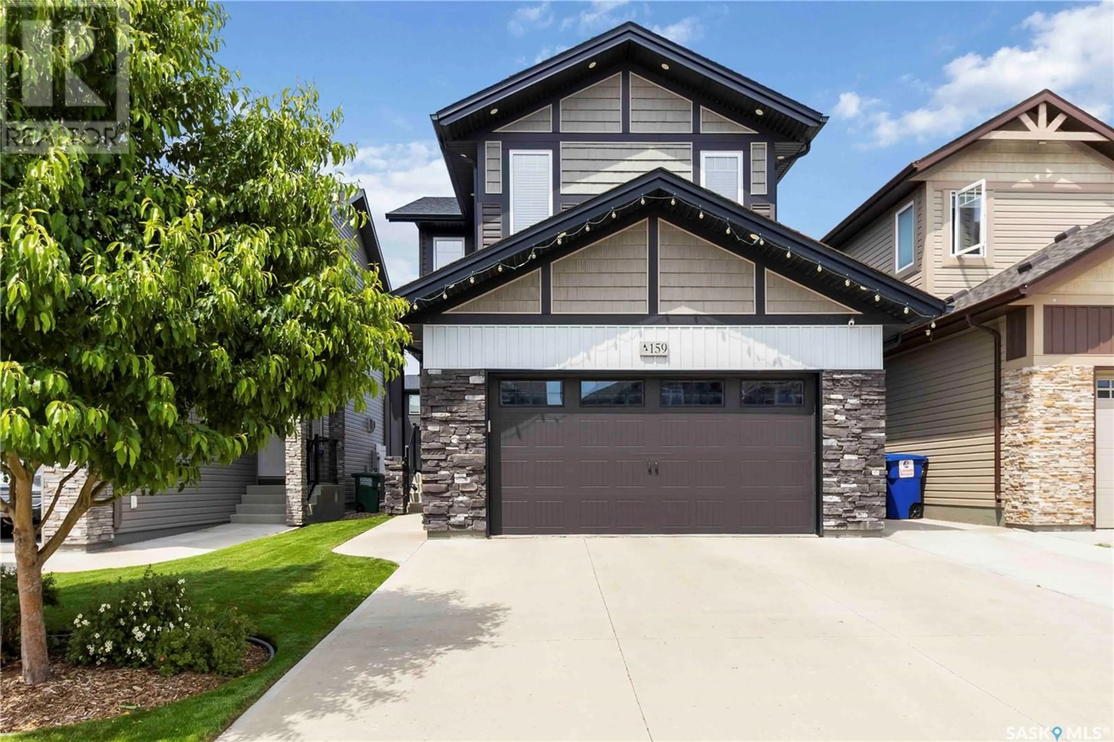 Home with vinyl exterior material, street for 159 DAGNONE LANE, Saskatoon Saskatchewan S7V0R1