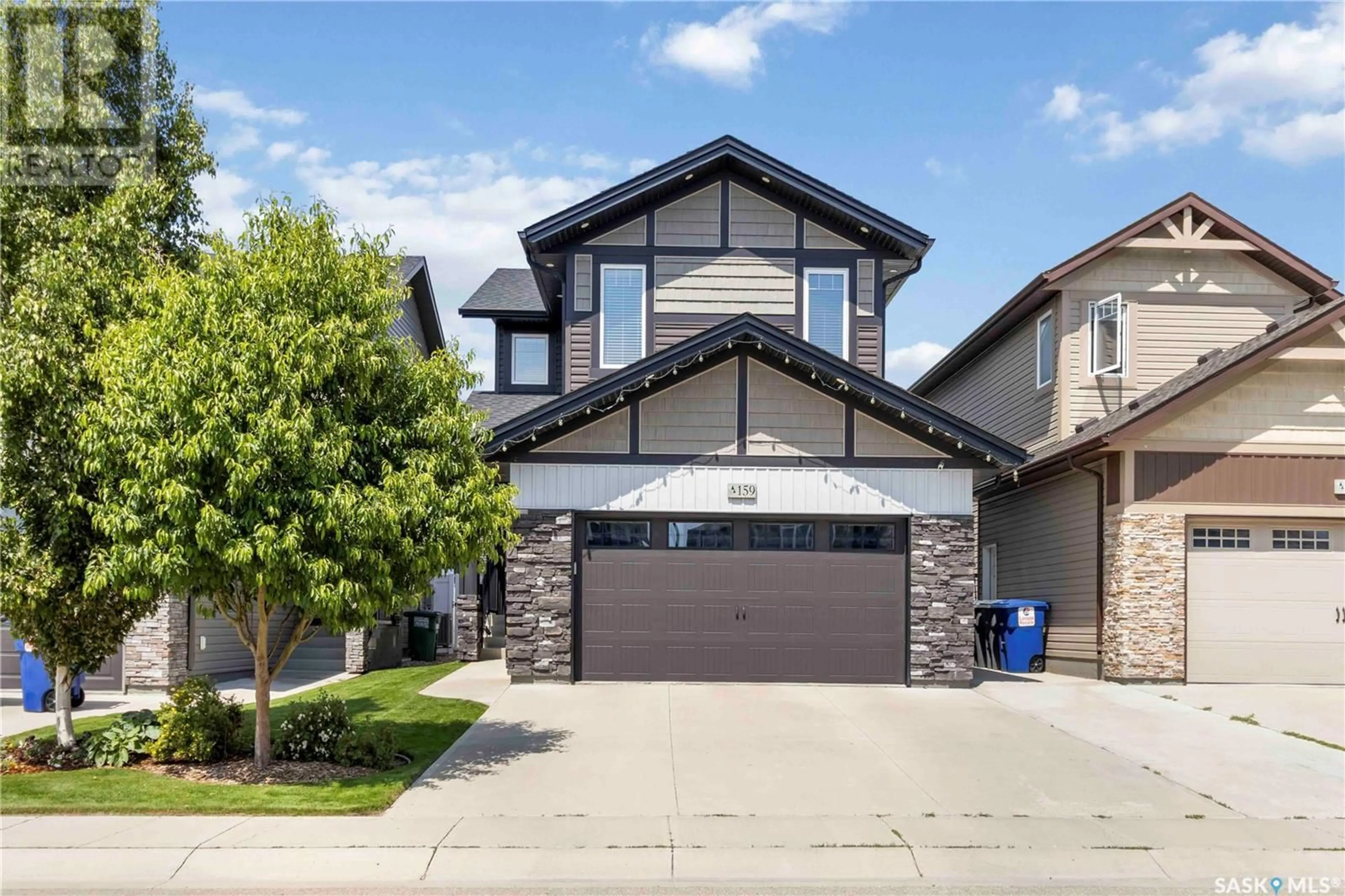 Home with brick exterior material, street for 159 DAGNONE LANE, Saskatoon Saskatchewan S7V0R1