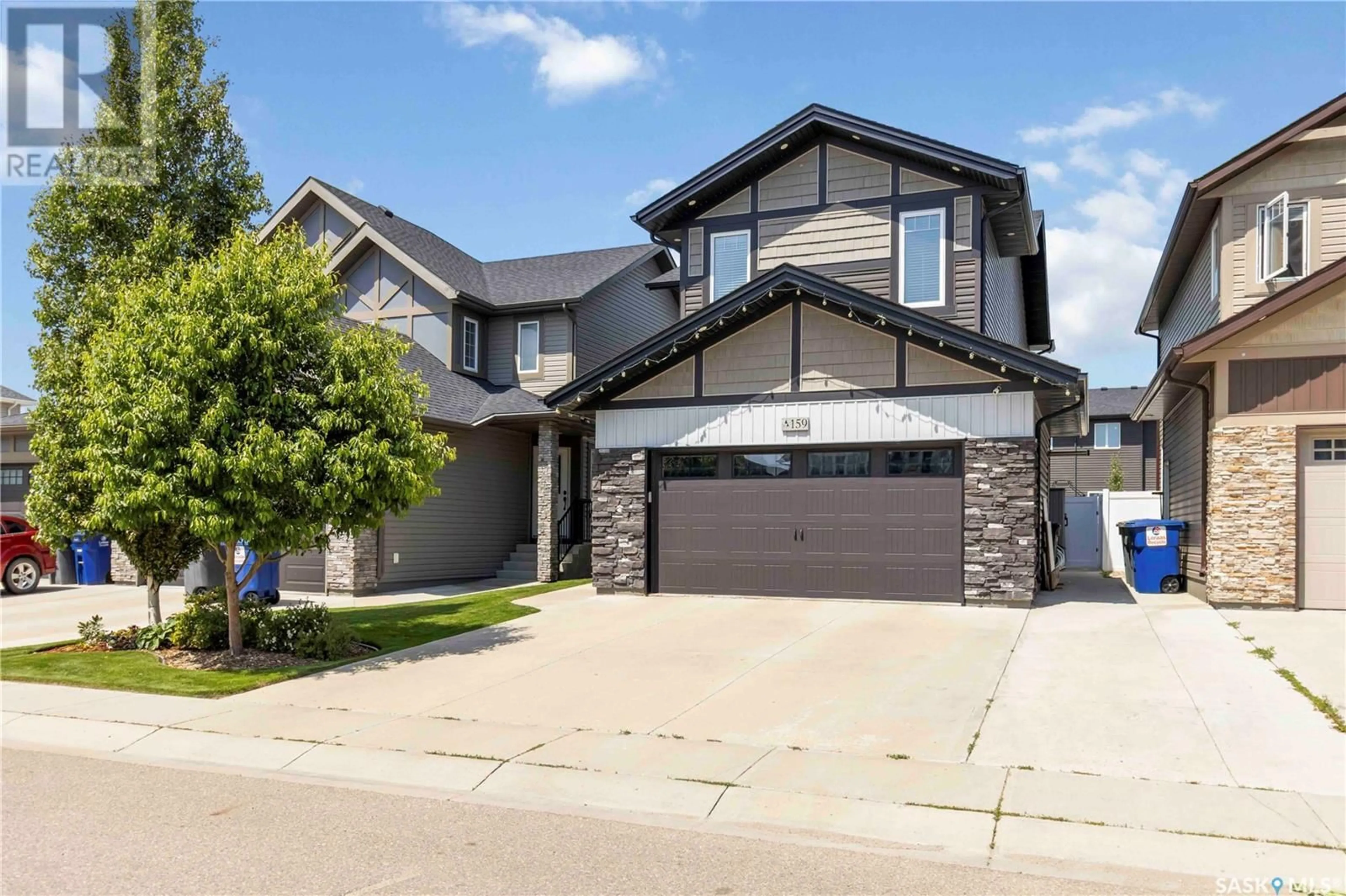 Home with vinyl exterior material, street for 159 DAGNONE LANE, Saskatoon Saskatchewan S7V0R1