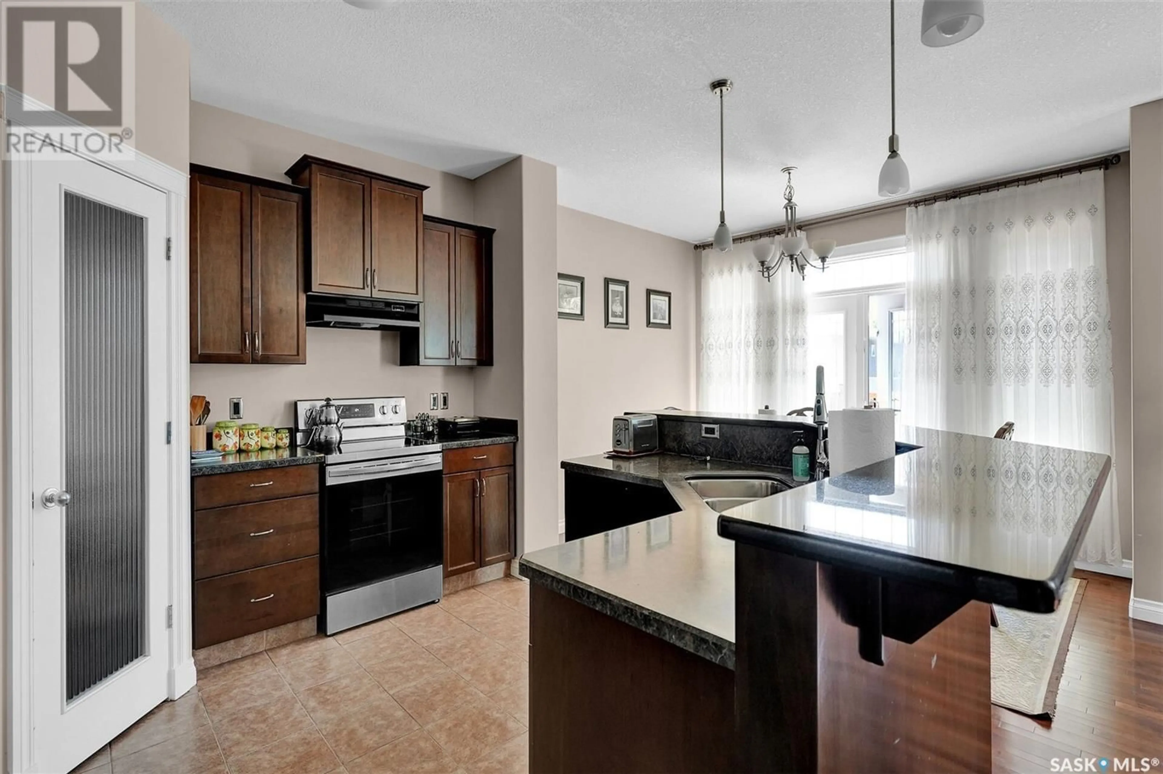 Open concept kitchen, ceramic/tile floor for 4847 BETKER PLACE, Regina Saskatchewan S4X4T8