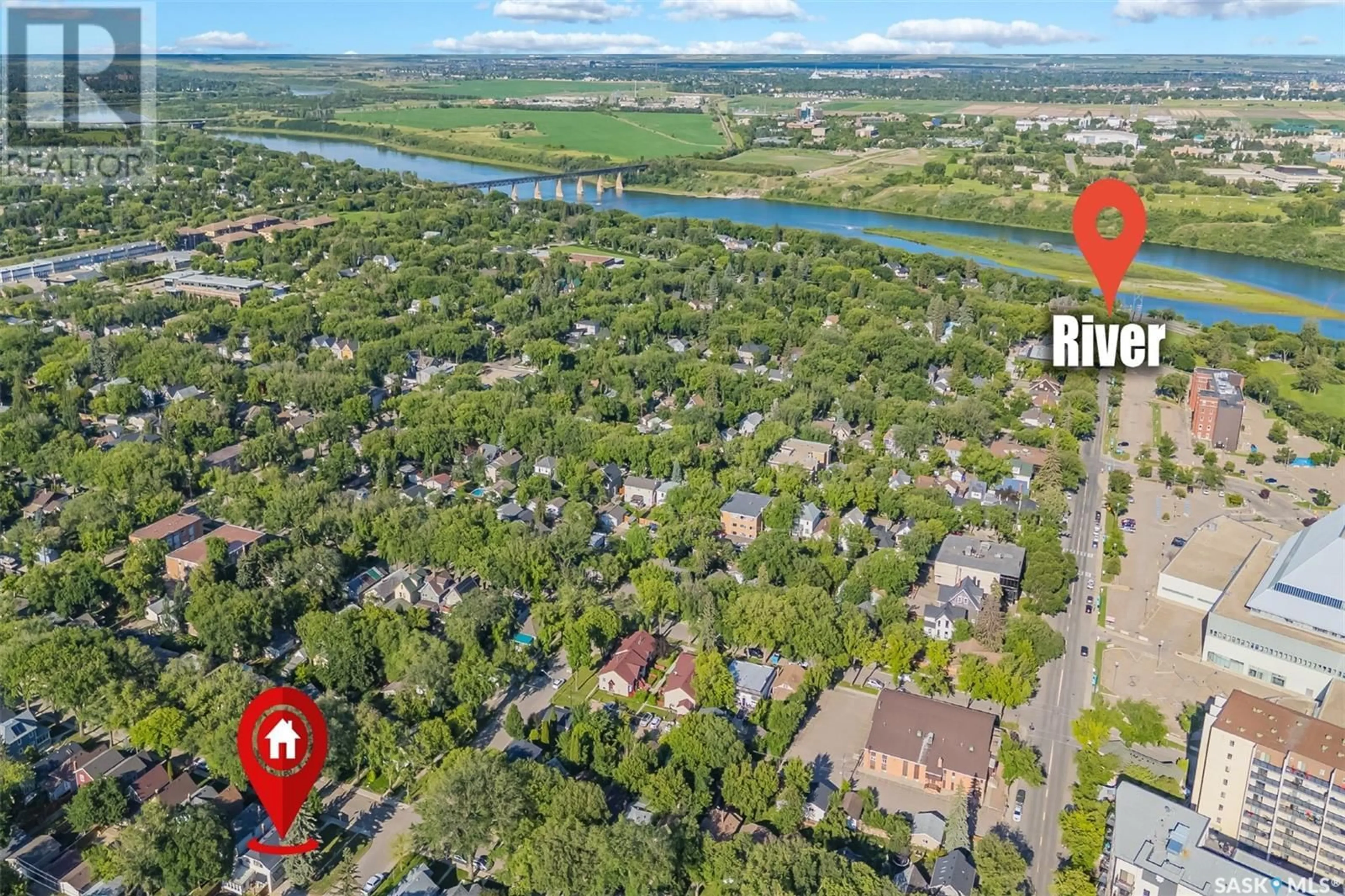 A pic from outside/outdoor area/front of a property/back of a property/a pic from drone, water/lake/river/ocean view for 703 4TH AVENUE, Saskatoon Saskatchewan S7K2N2