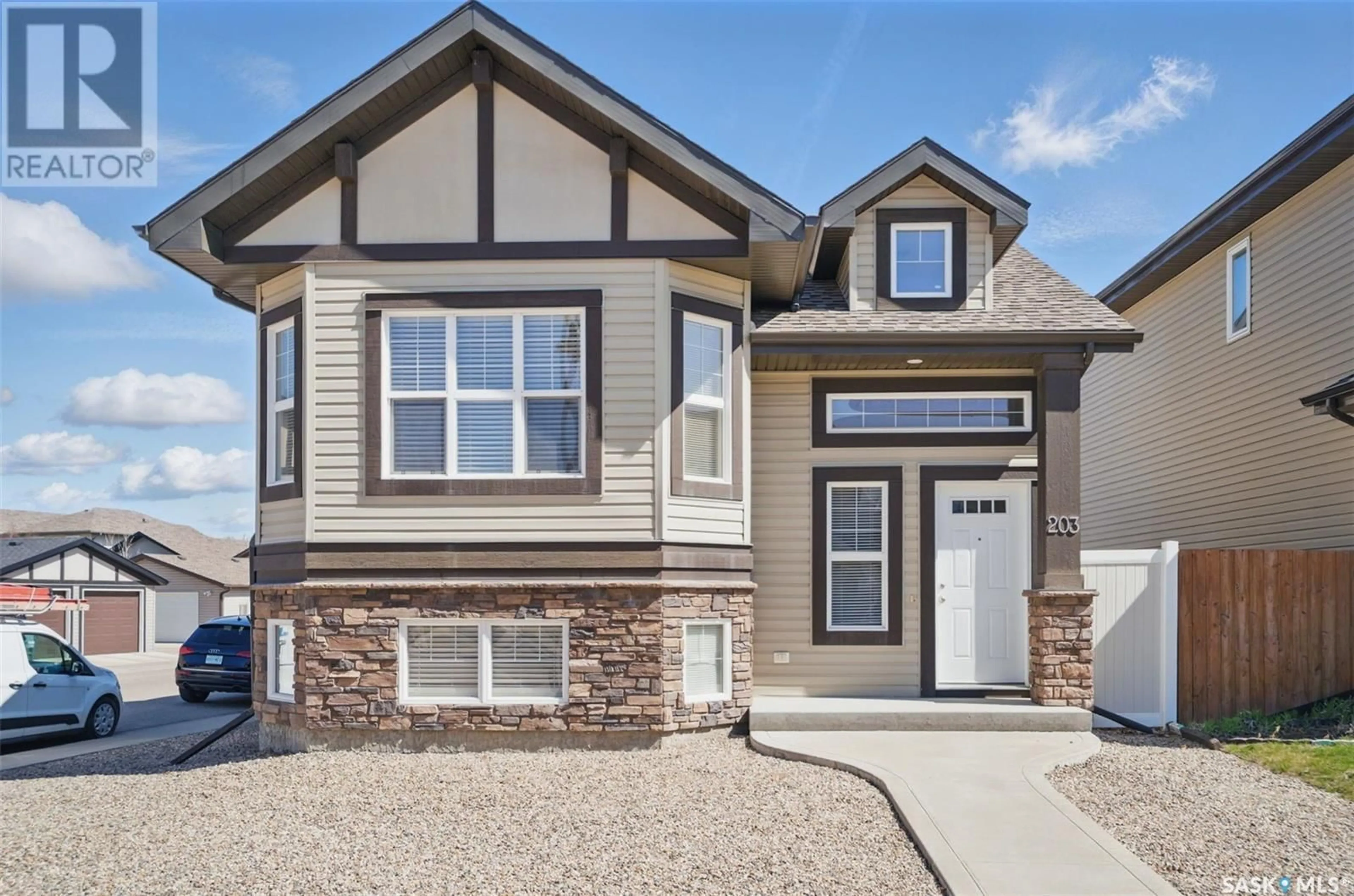 Home with vinyl exterior material, street for 203 LANGLOIS WAY, Saskatoon Saskatchewan S7T0K8