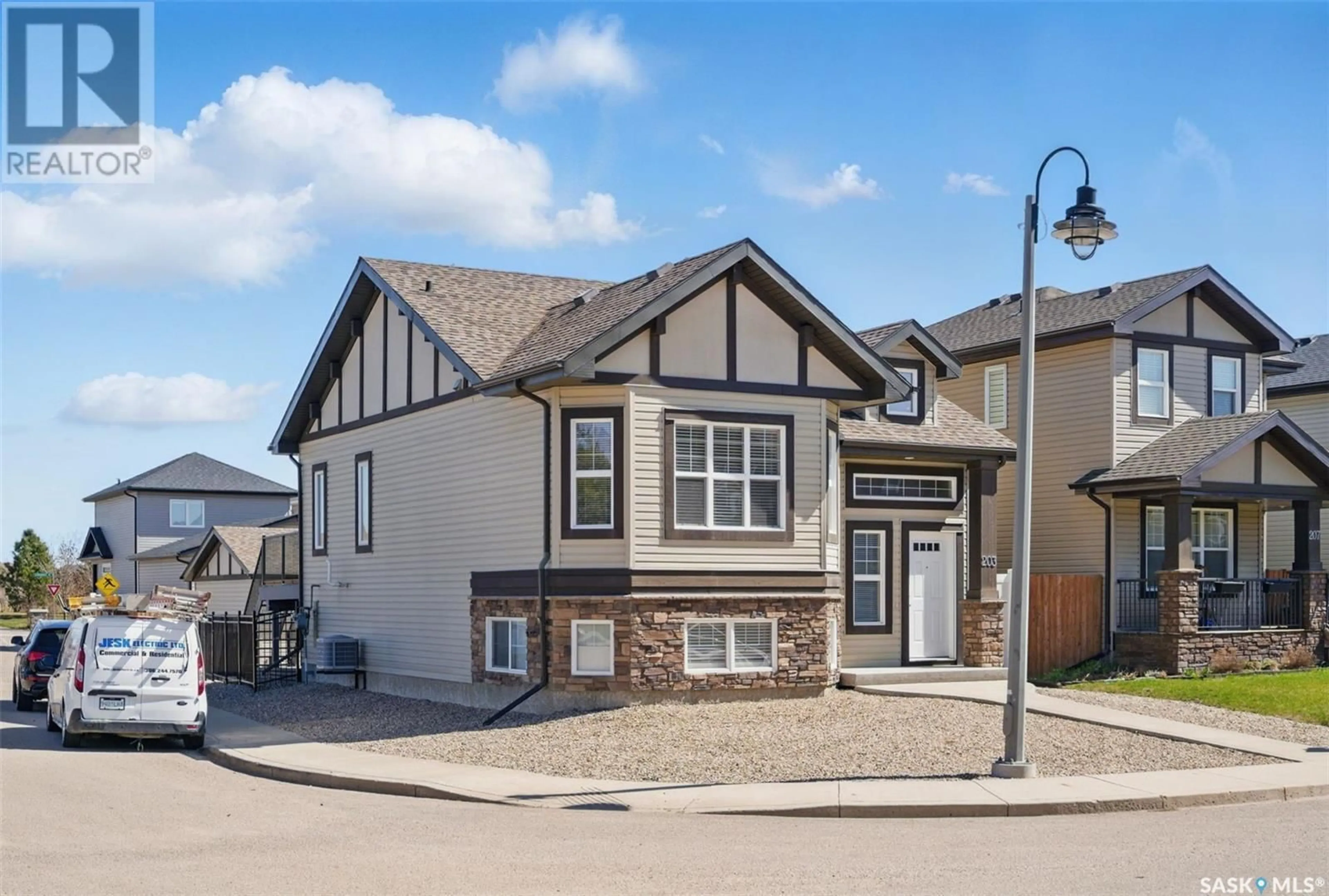 Home with vinyl exterior material, street for 203 LANGLOIS WAY, Saskatoon Saskatchewan S7T0K8