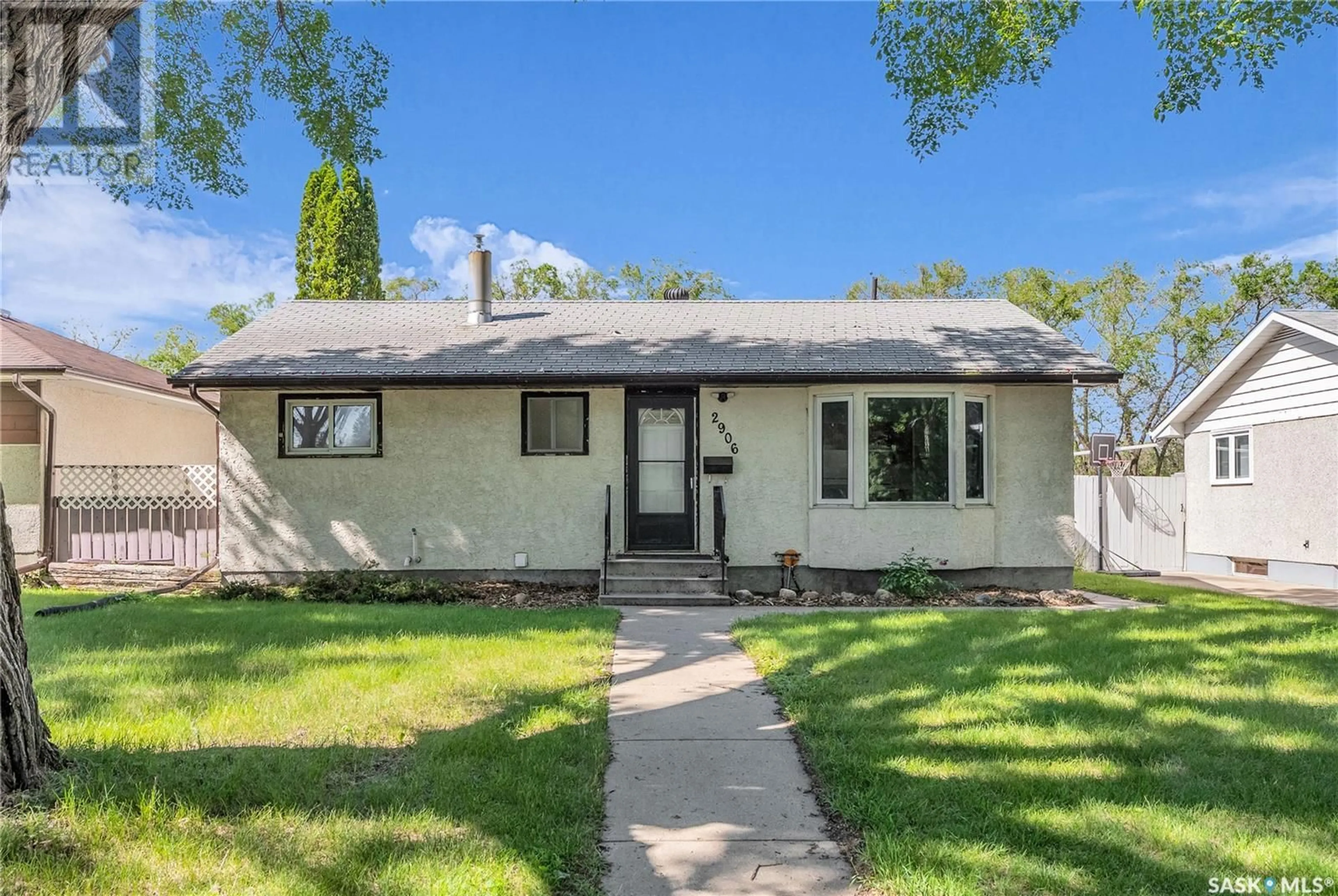 Home with vinyl exterior material, street for 2906 21ST STREET, Saskatoon Saskatchewan S7M0W5