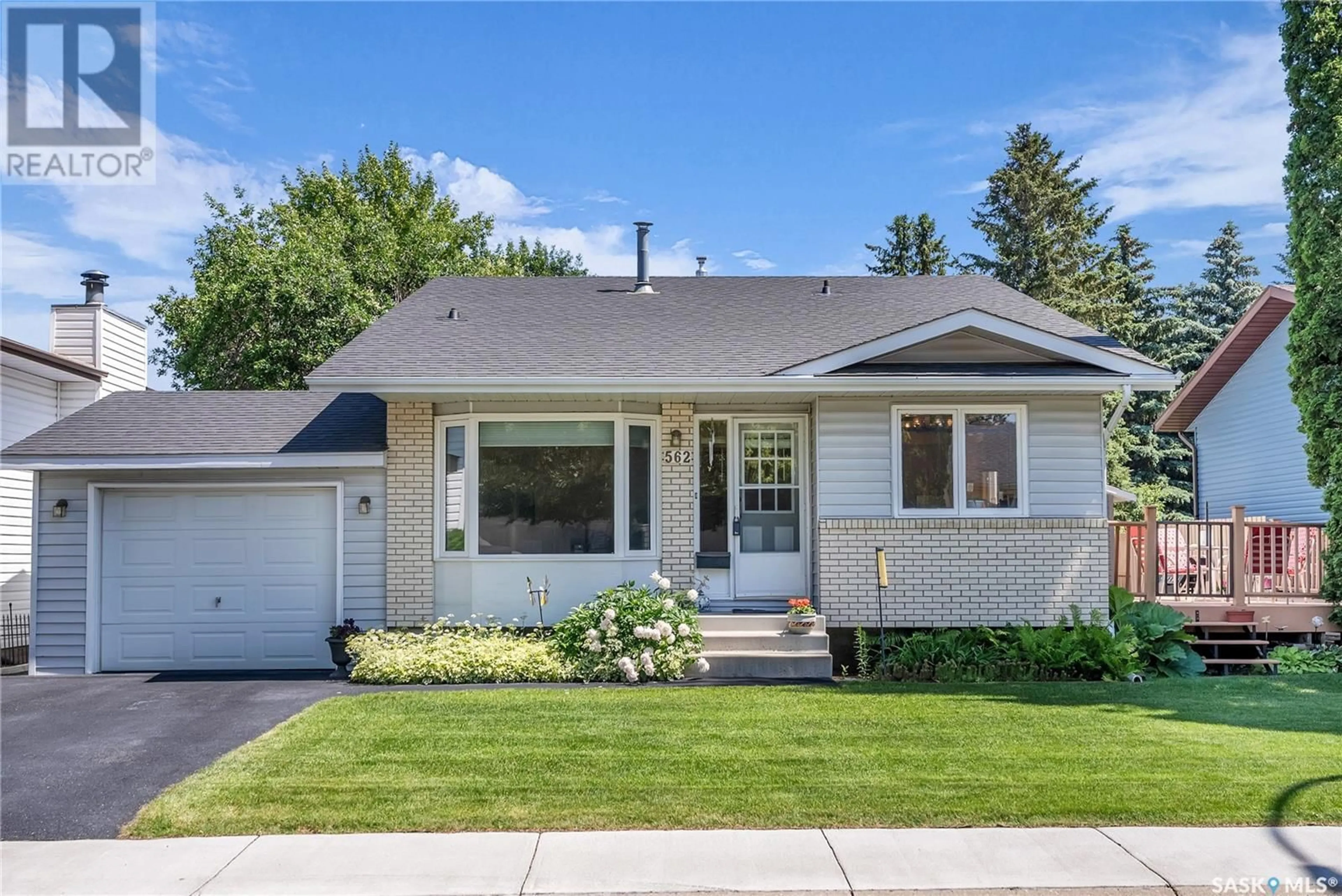 Home with vinyl exterior material, street for 562 WOLLASTON TERRACE, Saskatoon Saskatchewan S7J4H2