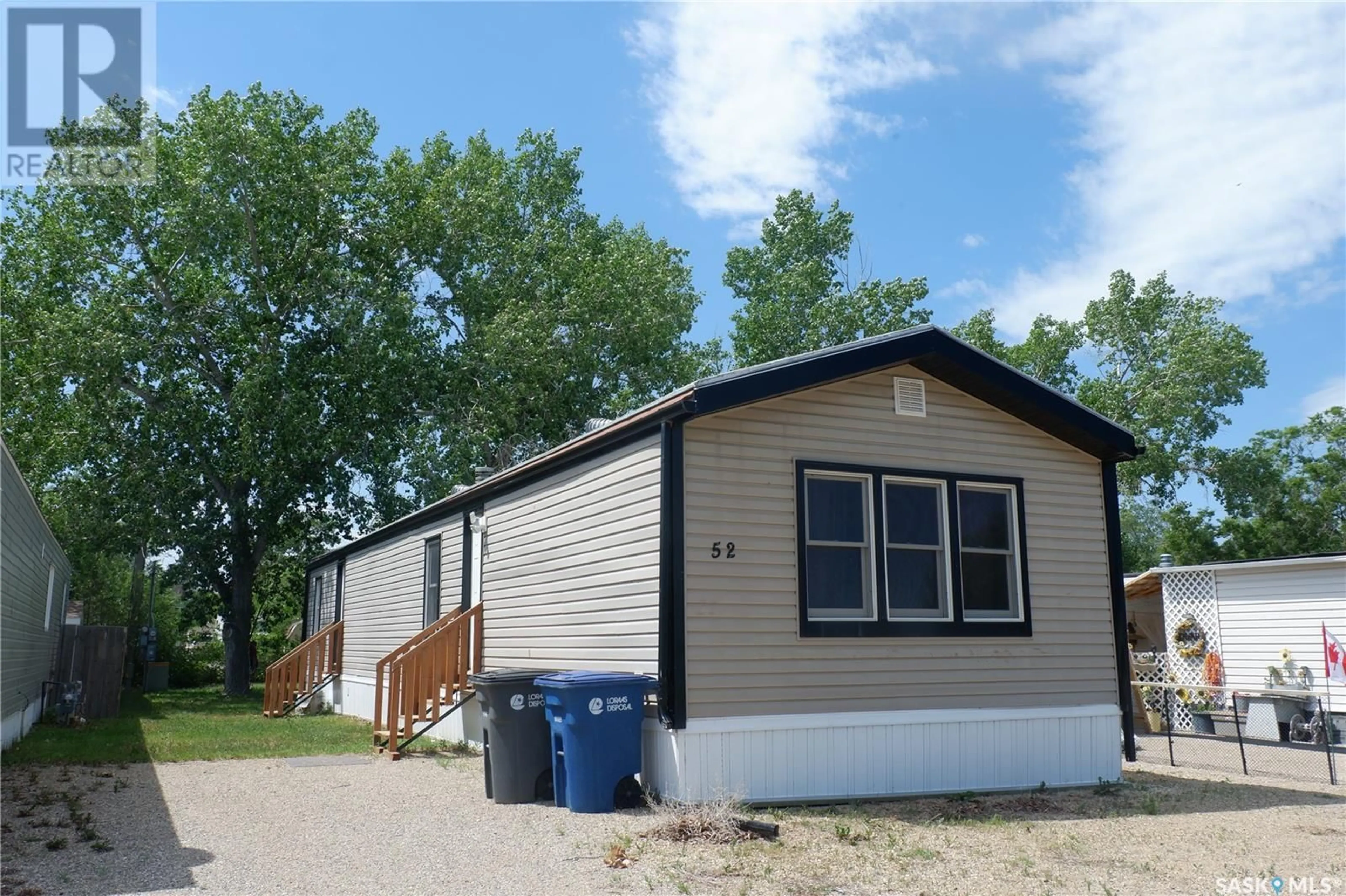 Home with vinyl exterior material, street for 52 SUNRISE ESTATES, Assiniboia Saskatchewan S0H0B0