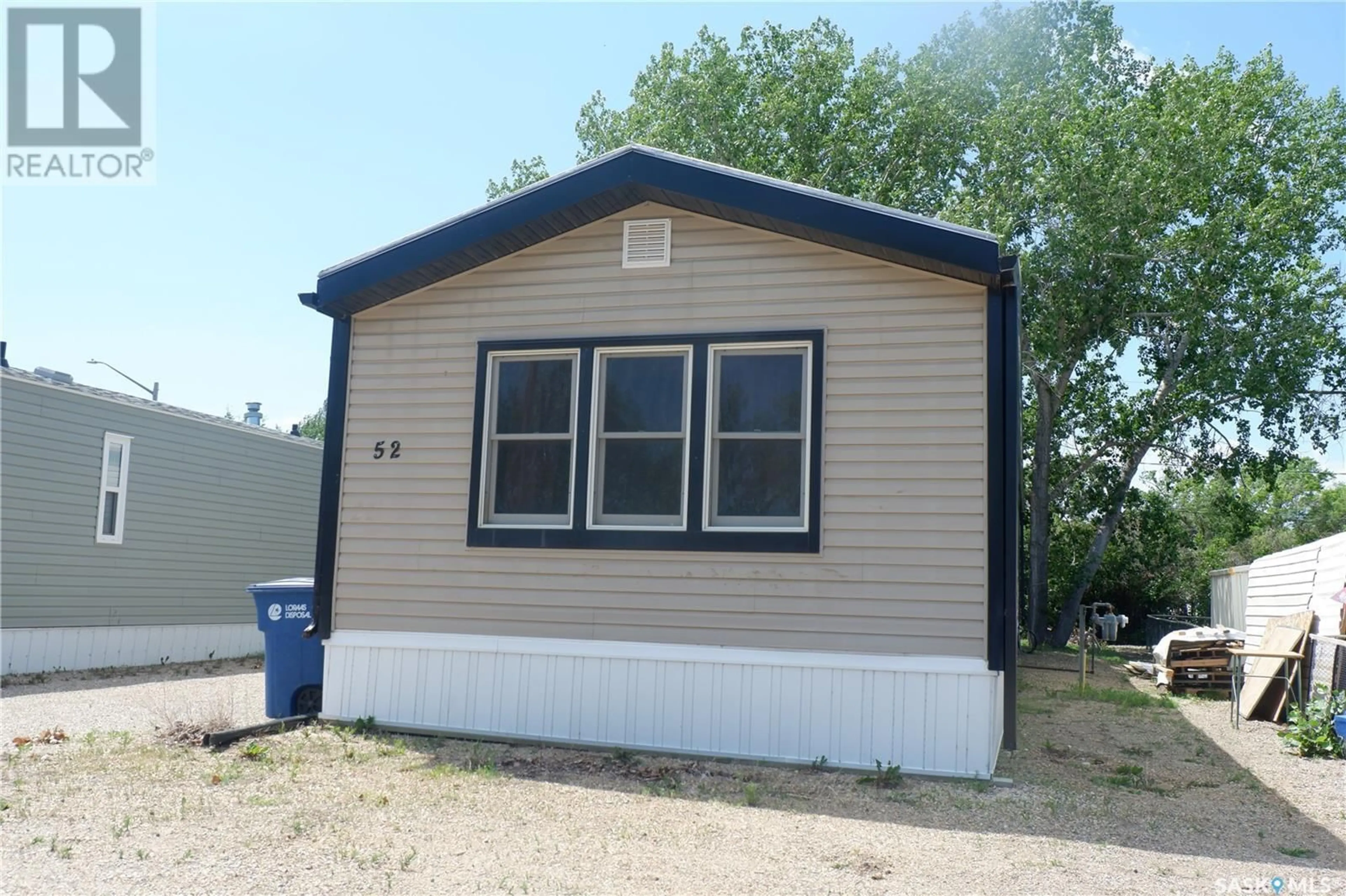 Home with vinyl exterior material, street for 52 SUNRISE ESTATES, Assiniboia Saskatchewan S0H0B0